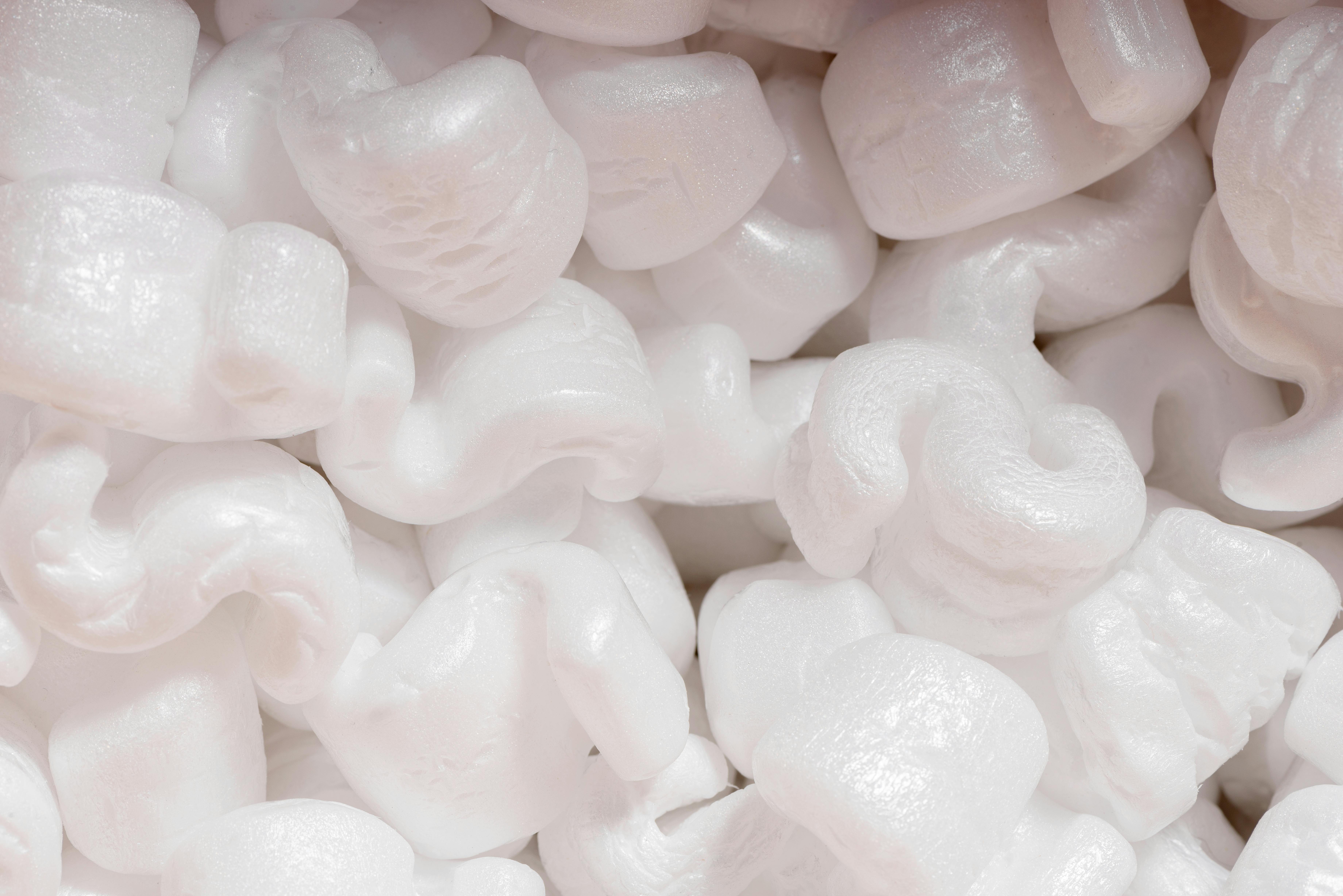 Polystyrene used in packaging, also shown as a potential material for insulation in buildings.