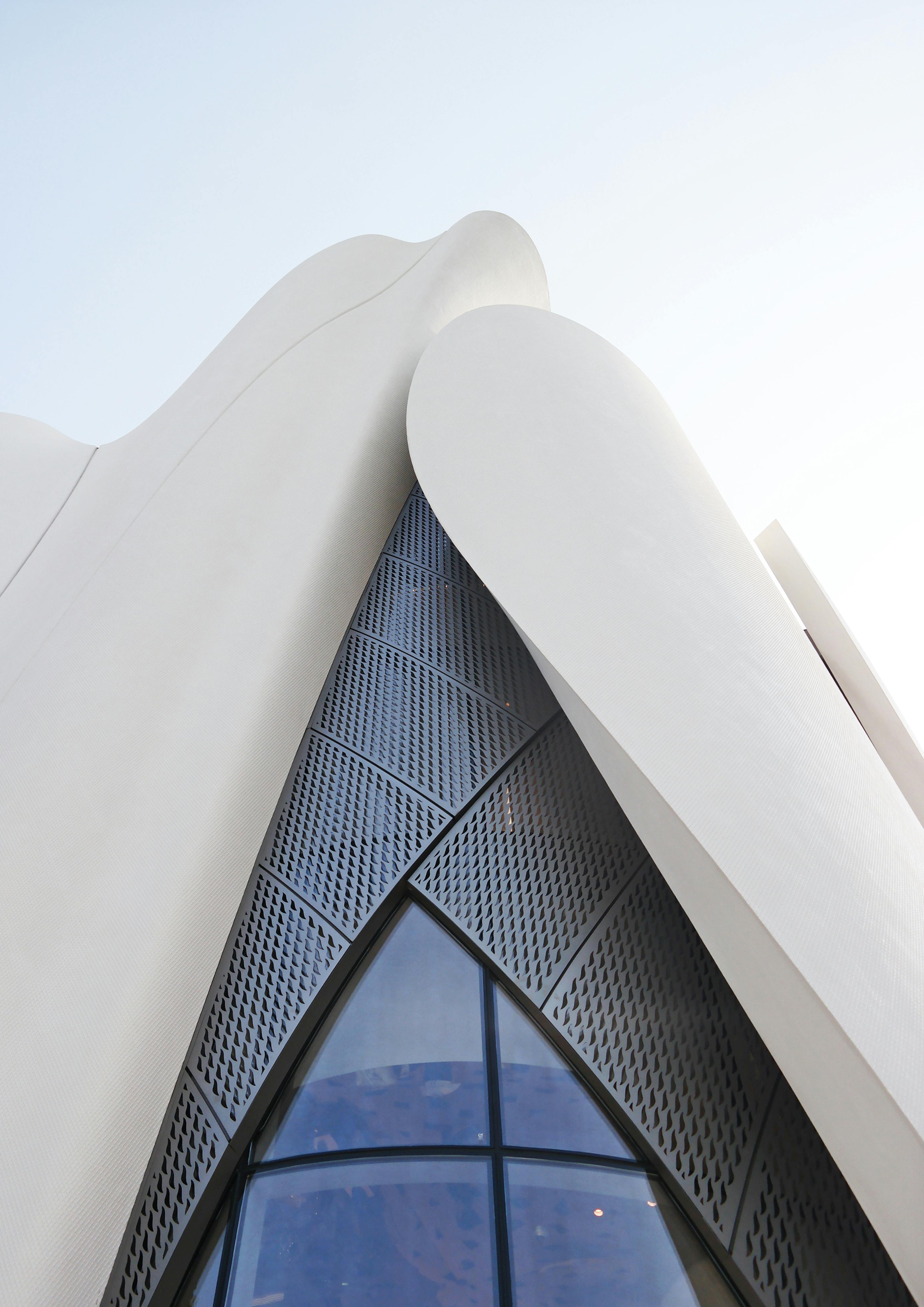 A modern white concrete building in Seoul, showcasing contemporary architectural design with clean lines and minimalist style.