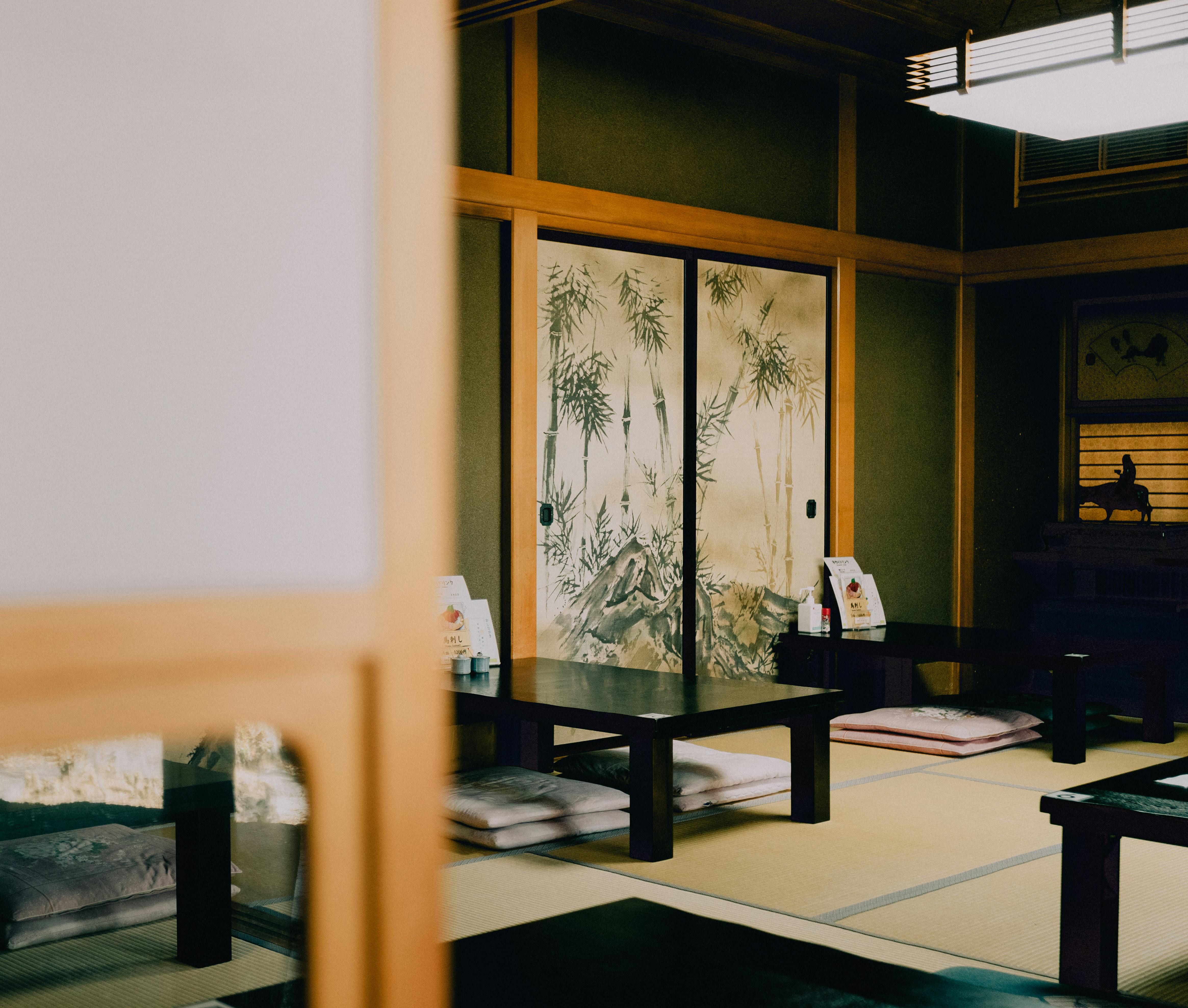 Traditional Japanese tatami room interior with sliding doors, showcasing elegant simplicity.