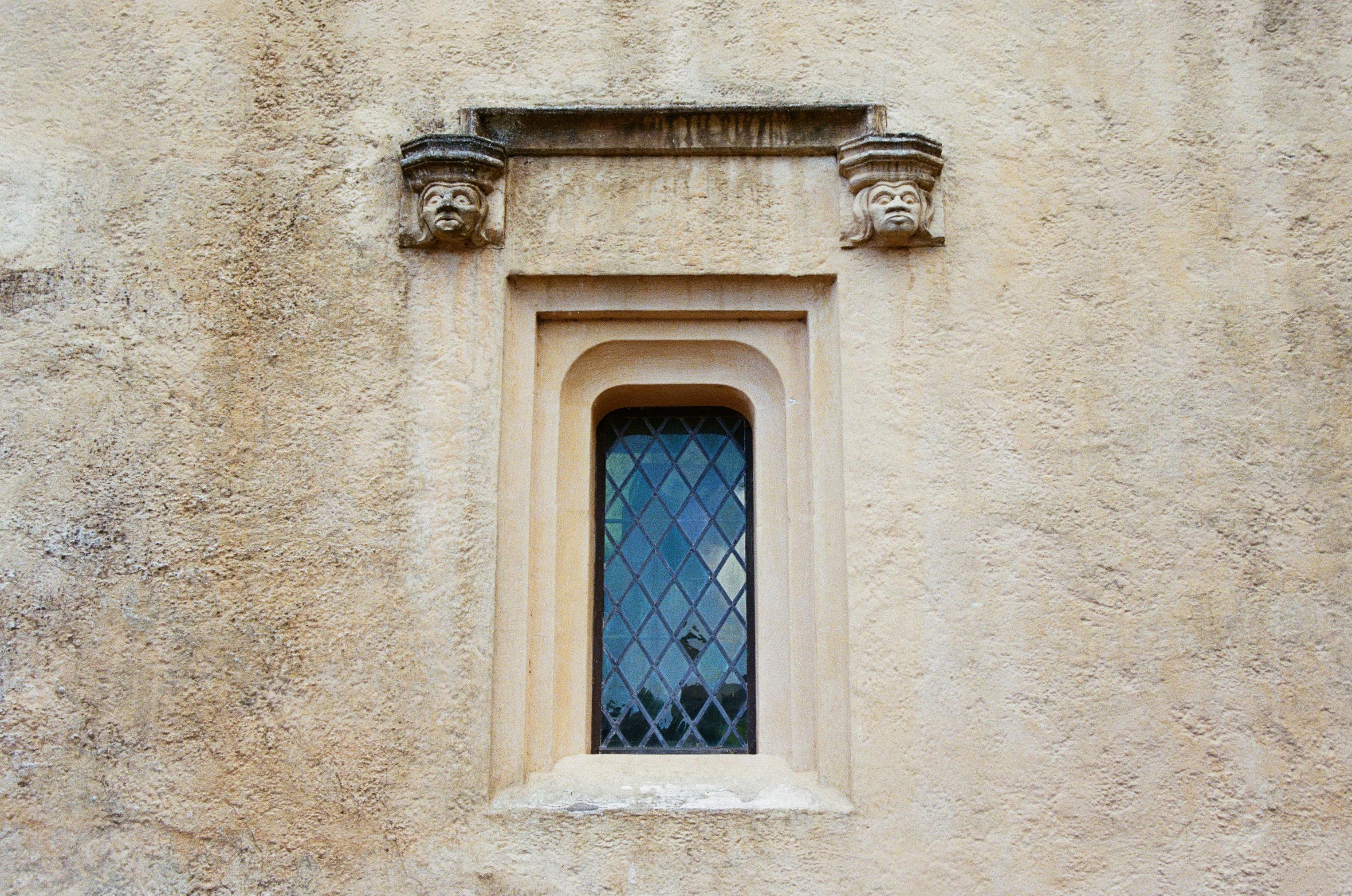 Stone-framed historic window at Stirling Castle overlooking the Scottish landscape.
