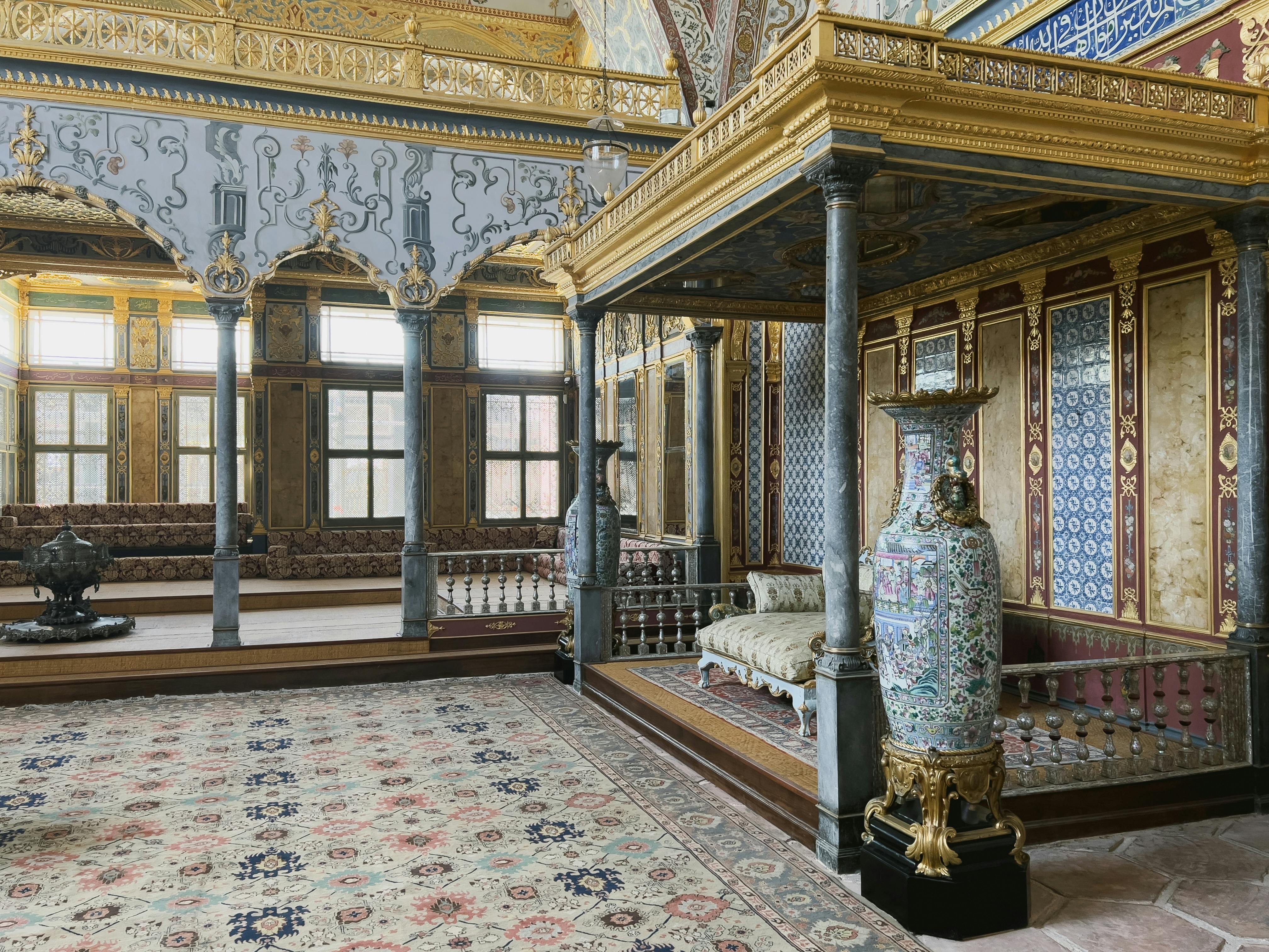 Room in Topkapi Palace with tiled walls and ornate furnishings.​