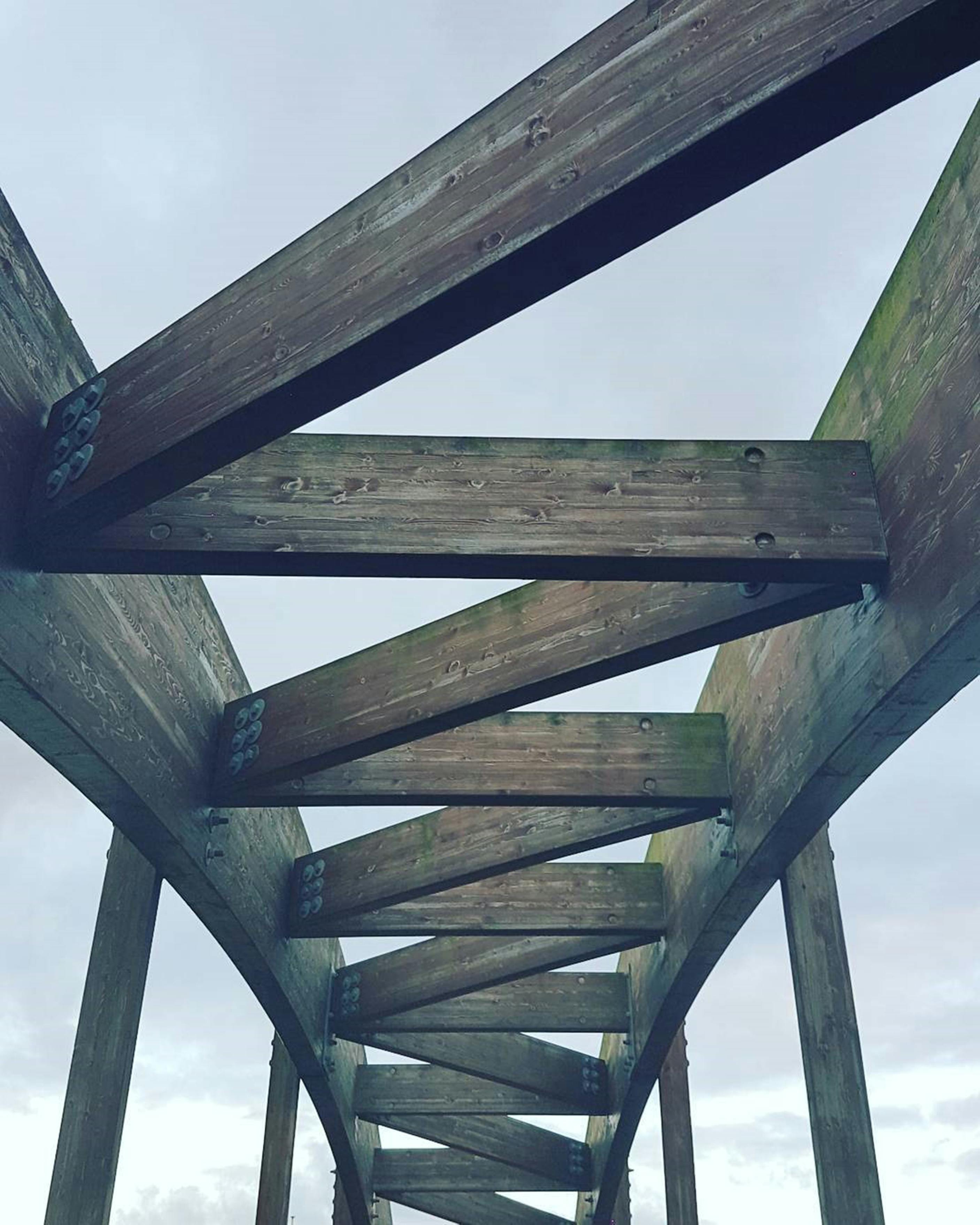 Wooden bridge showing timber as a primary structural material.