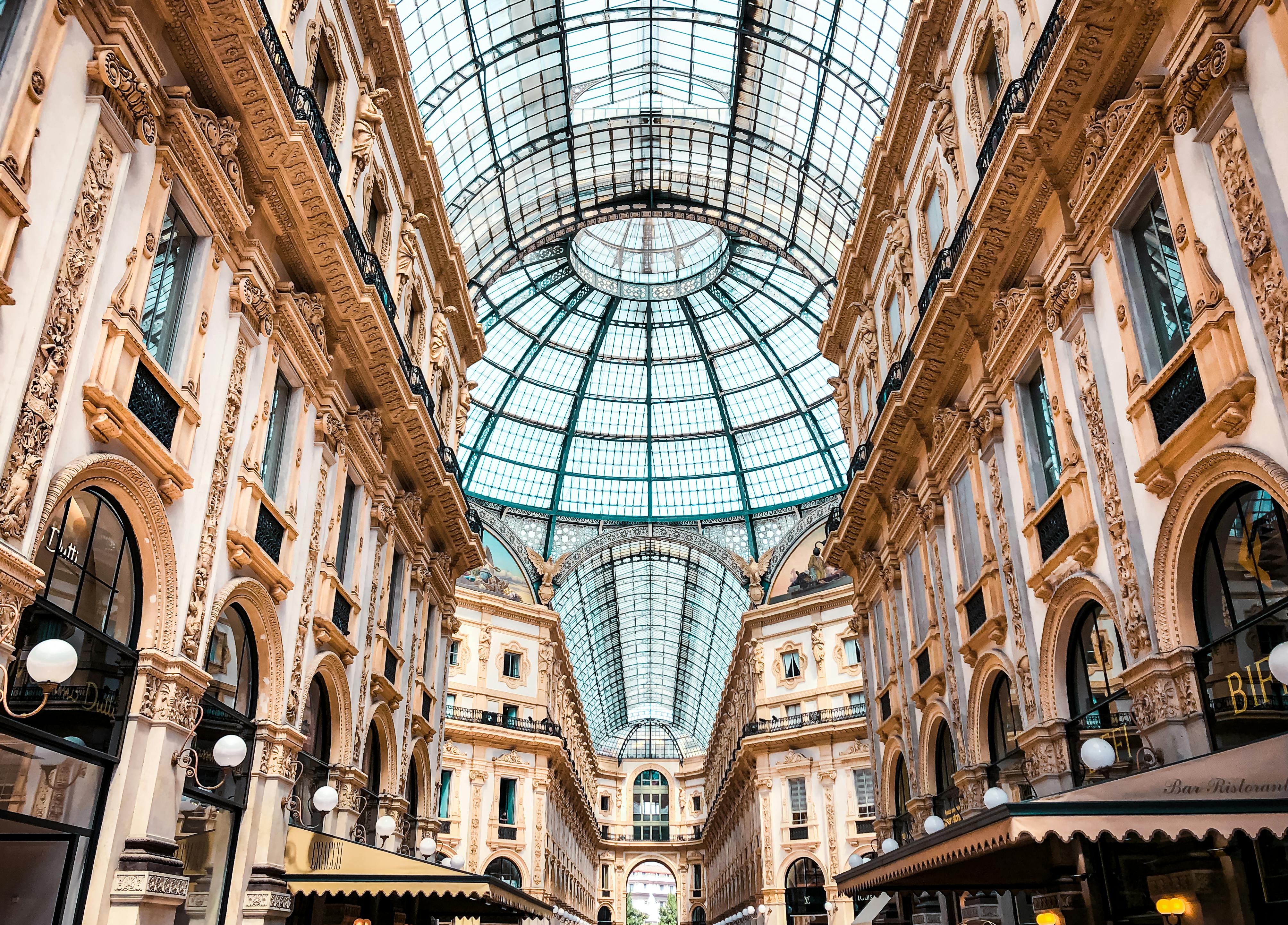 Glass-covered arcade in Milan inspired by ancient Roman design.