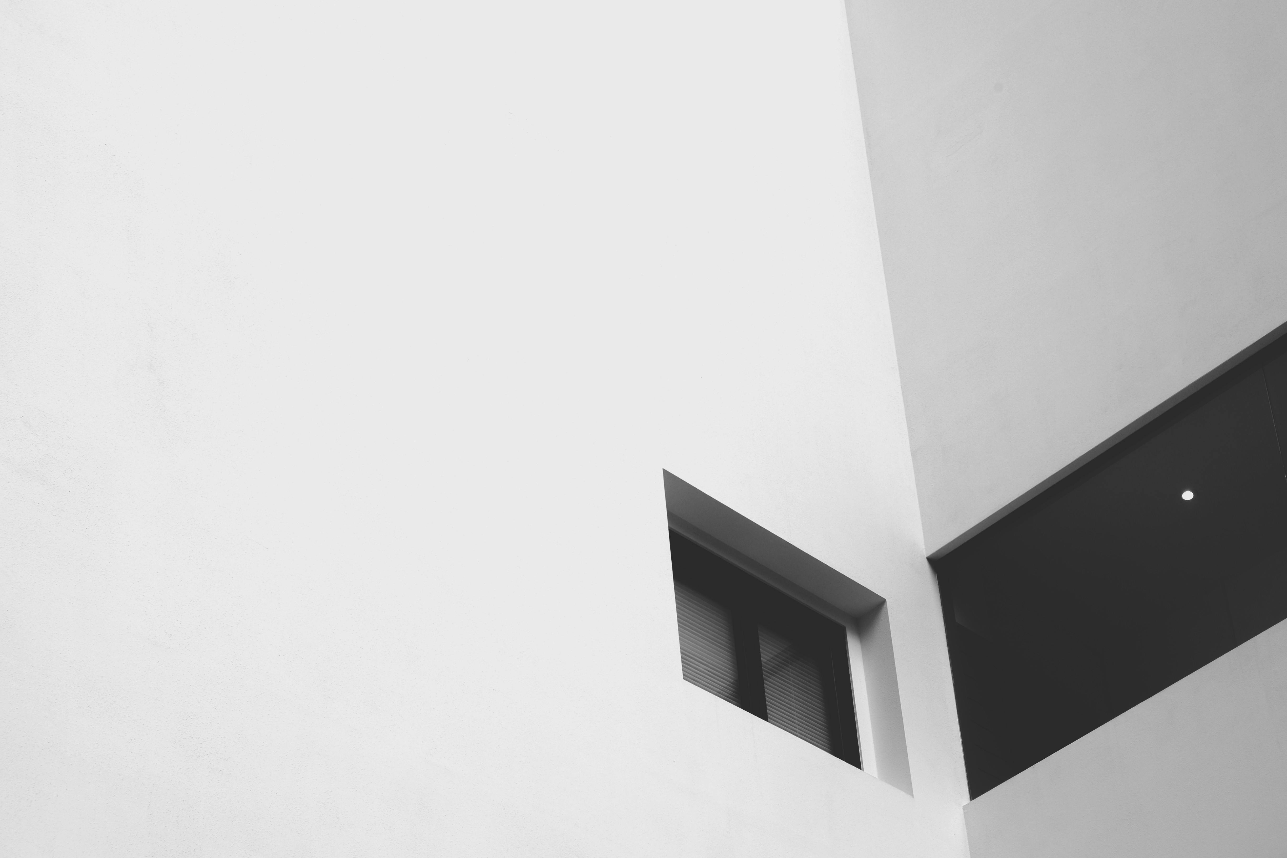 Window on white concrete building.