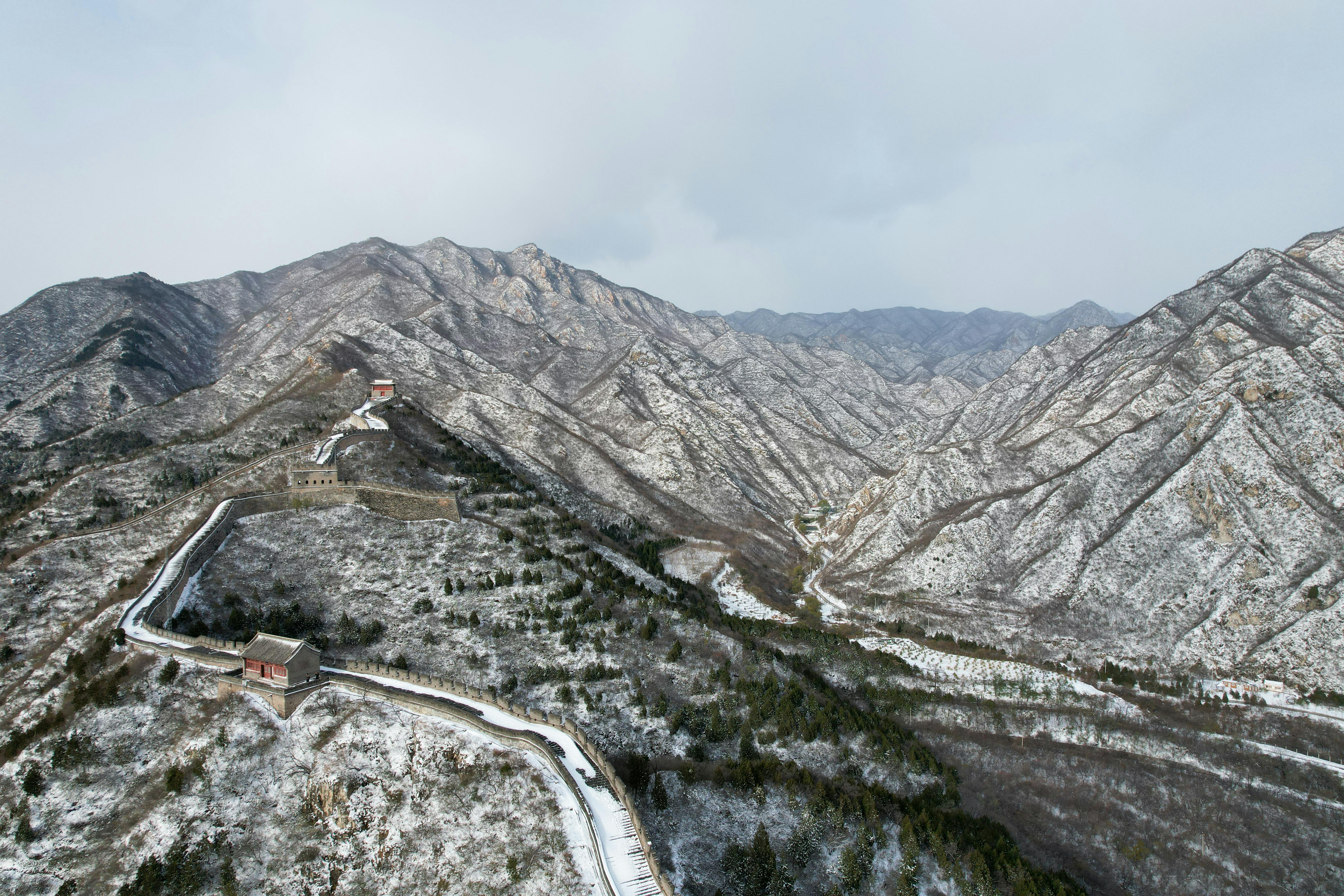 Aerial view of the Great Wall in Changping District showing winding structure and defense layout.