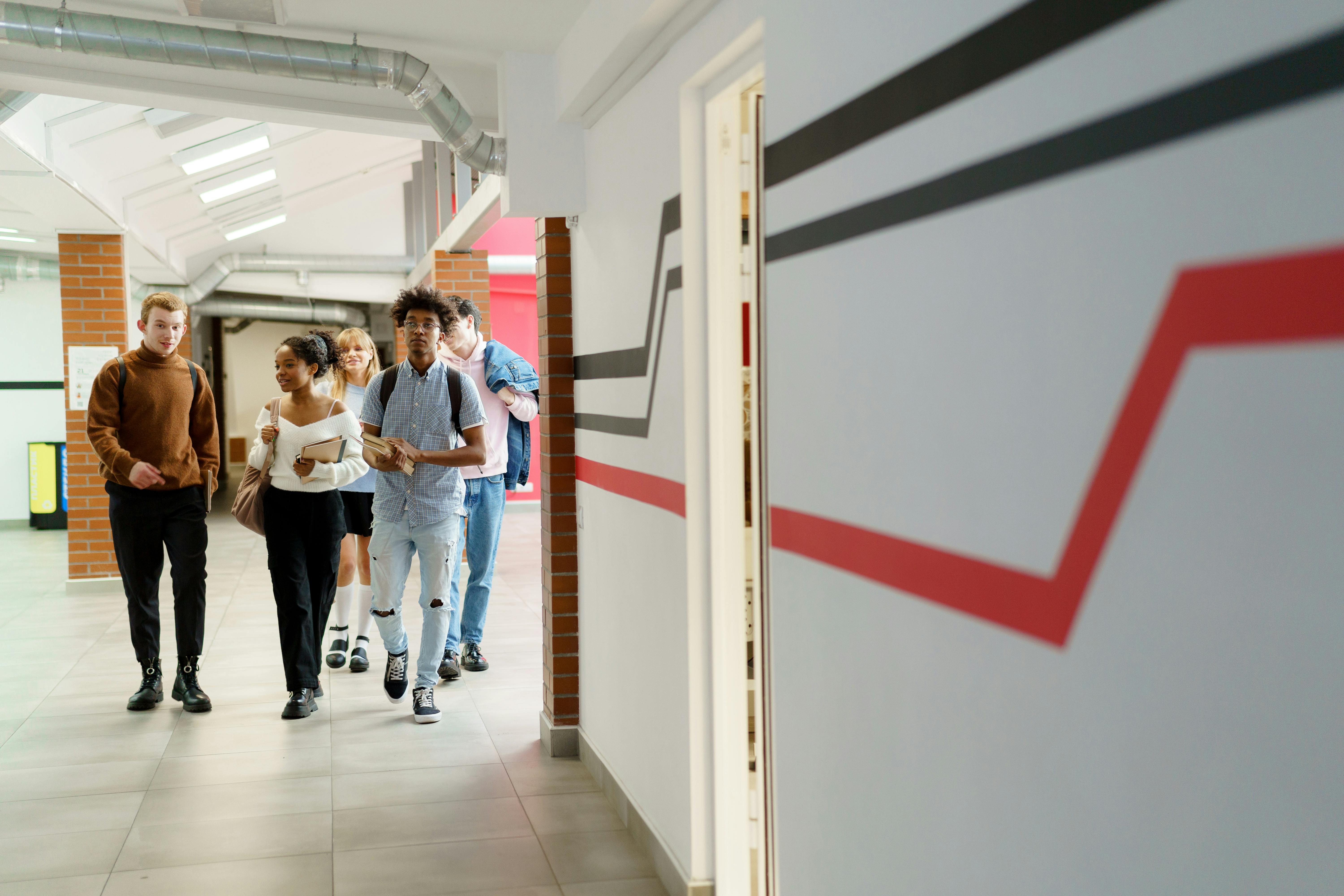 Students walking through a school hallway.