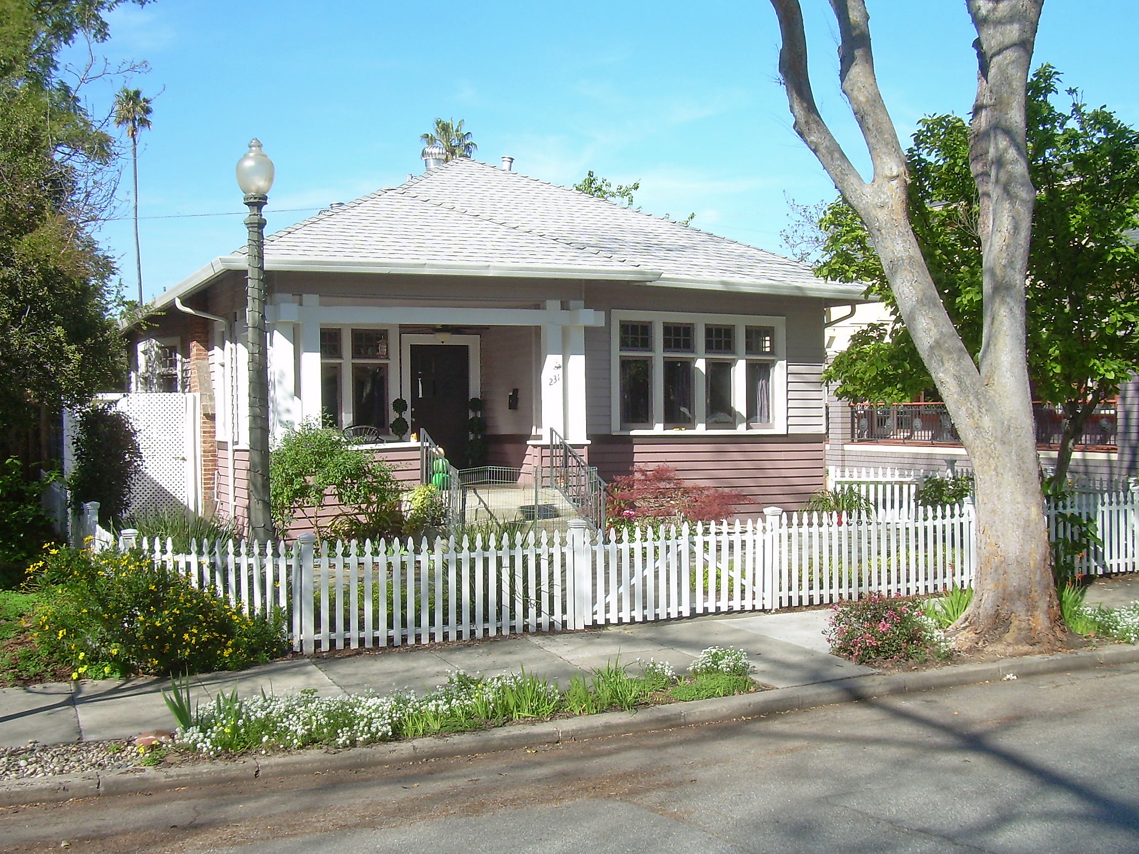 Craftsman bungalow with front porch and wood detailing.