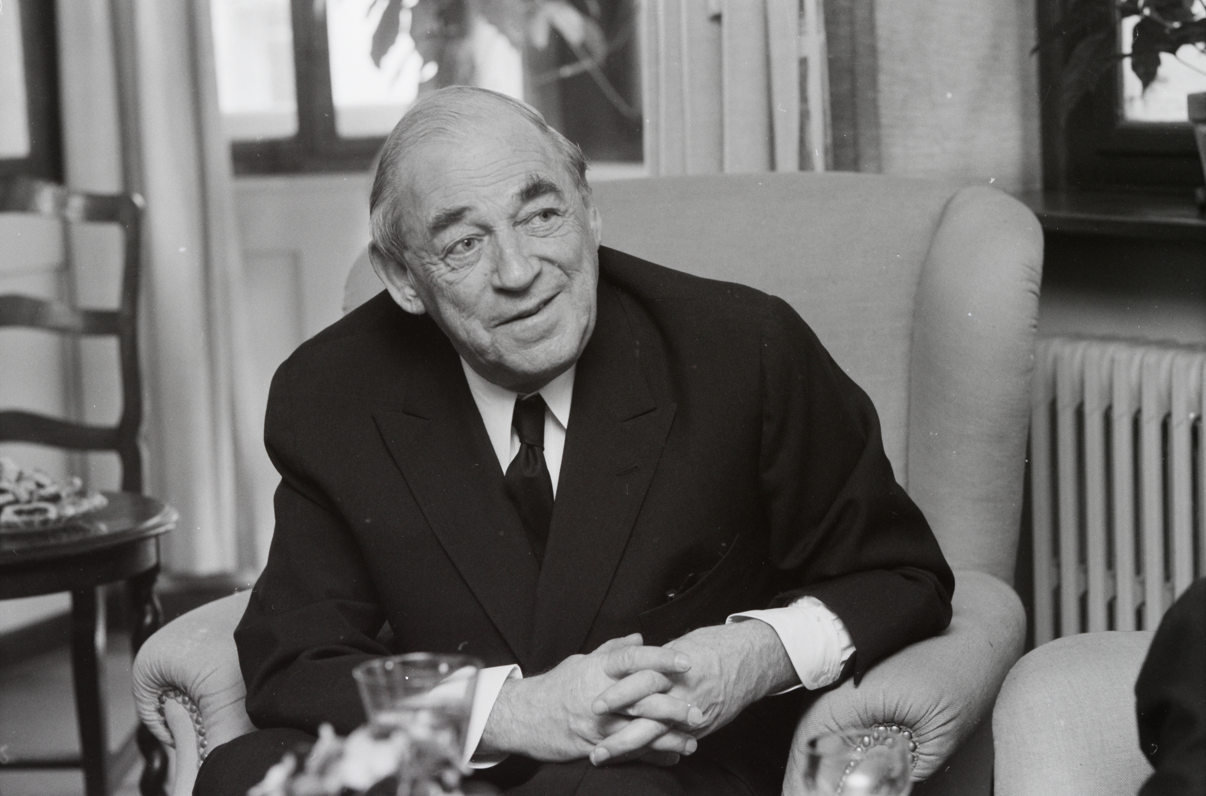 Portrait of Finnish architect Alvar Aalto, known for his human-centered modernist designs that blend function, nature, and organic forms.