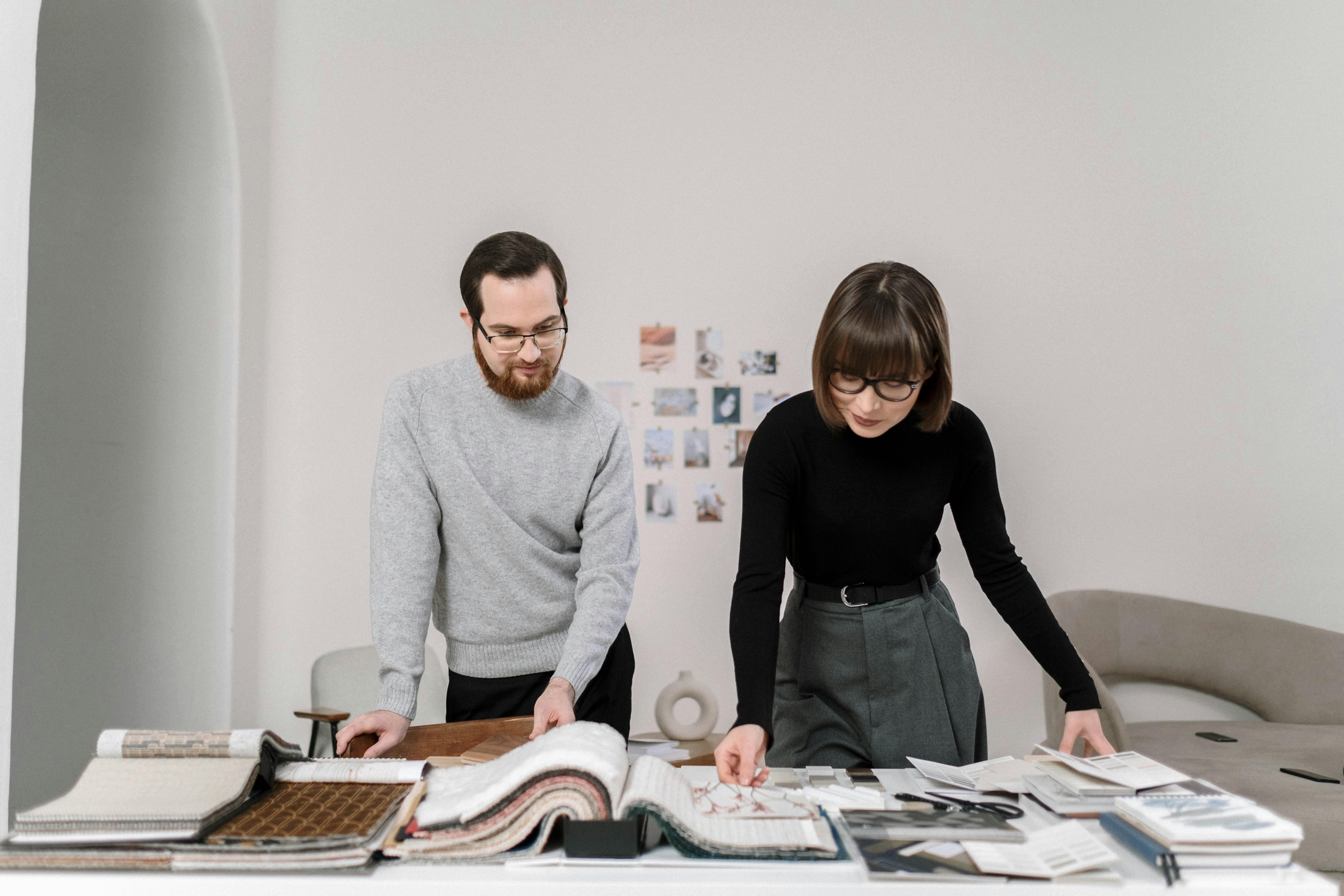 Architect and interior designer reviewing material samples.