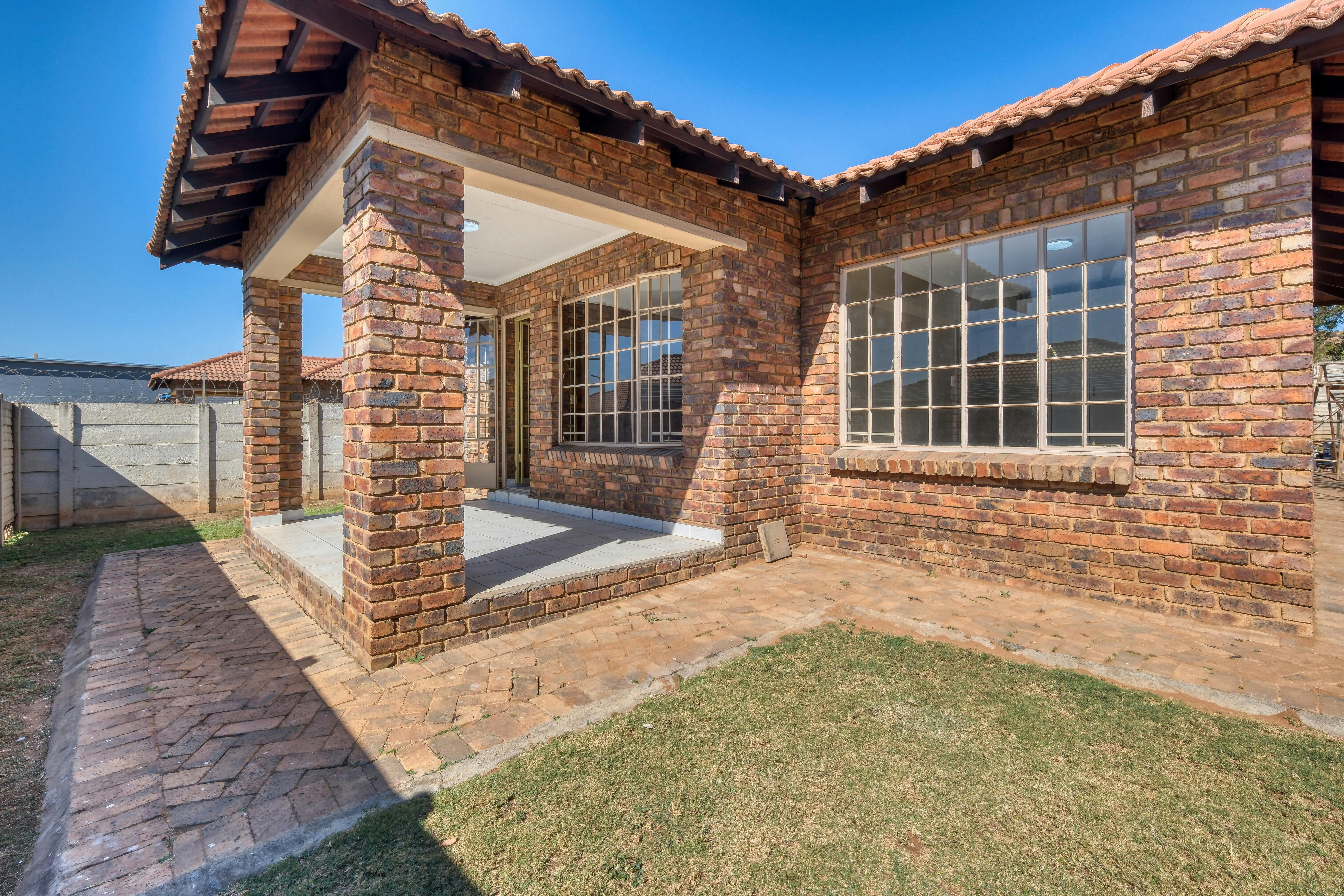 One-level brick house with modern and classic design.