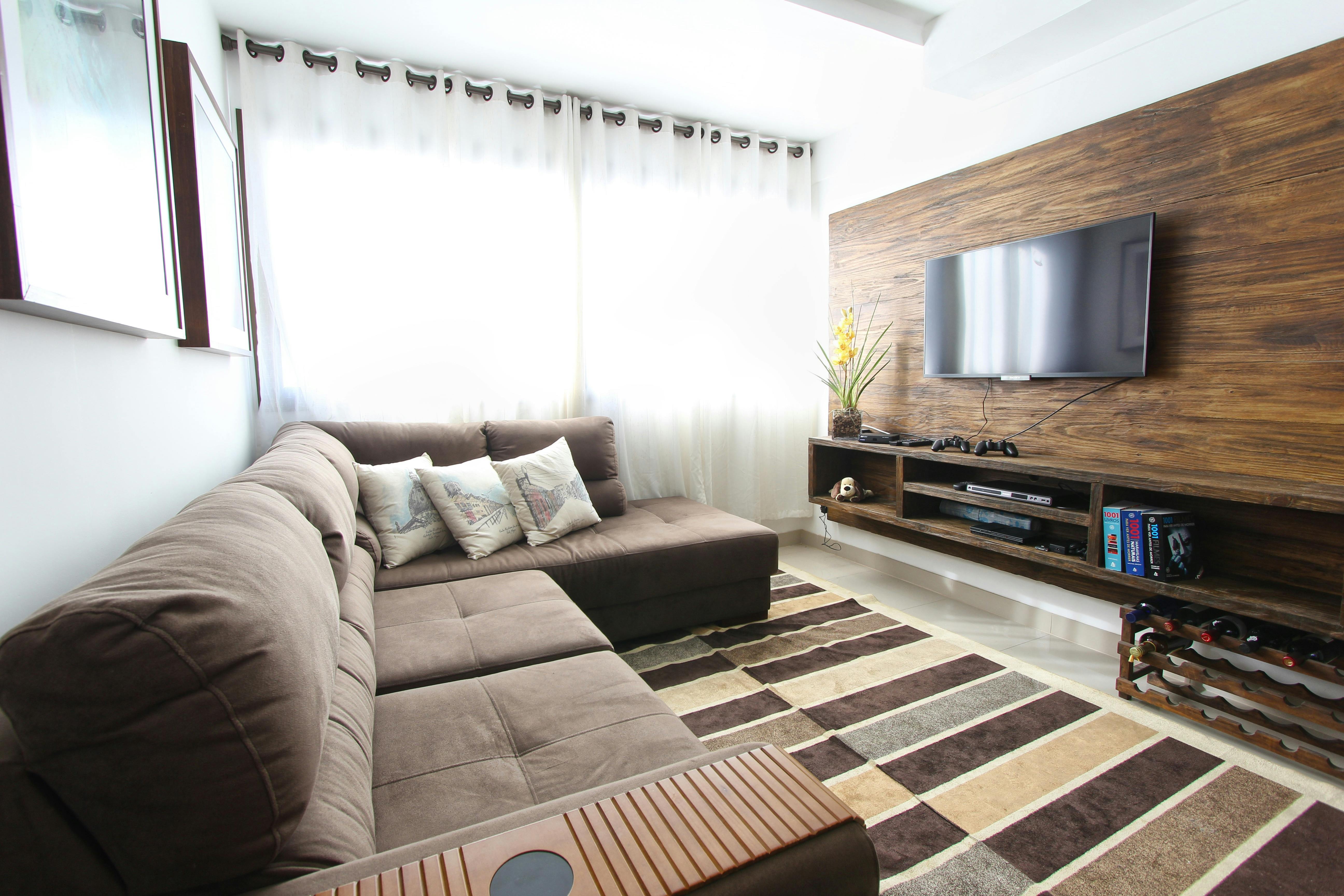 Living room designed with modern brown shades and warm accents.