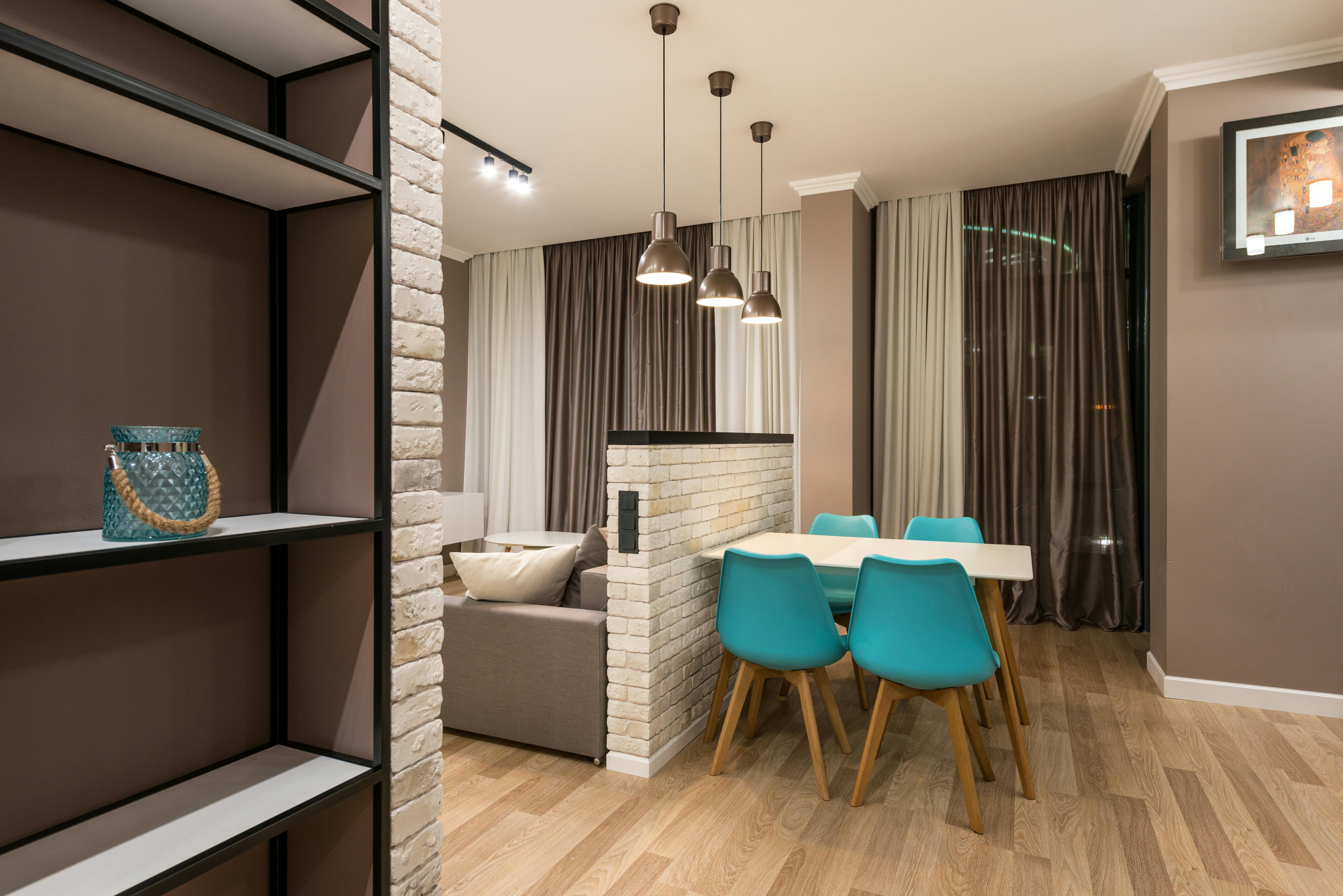 Small room with warm lighting and well-spaced furniture.
