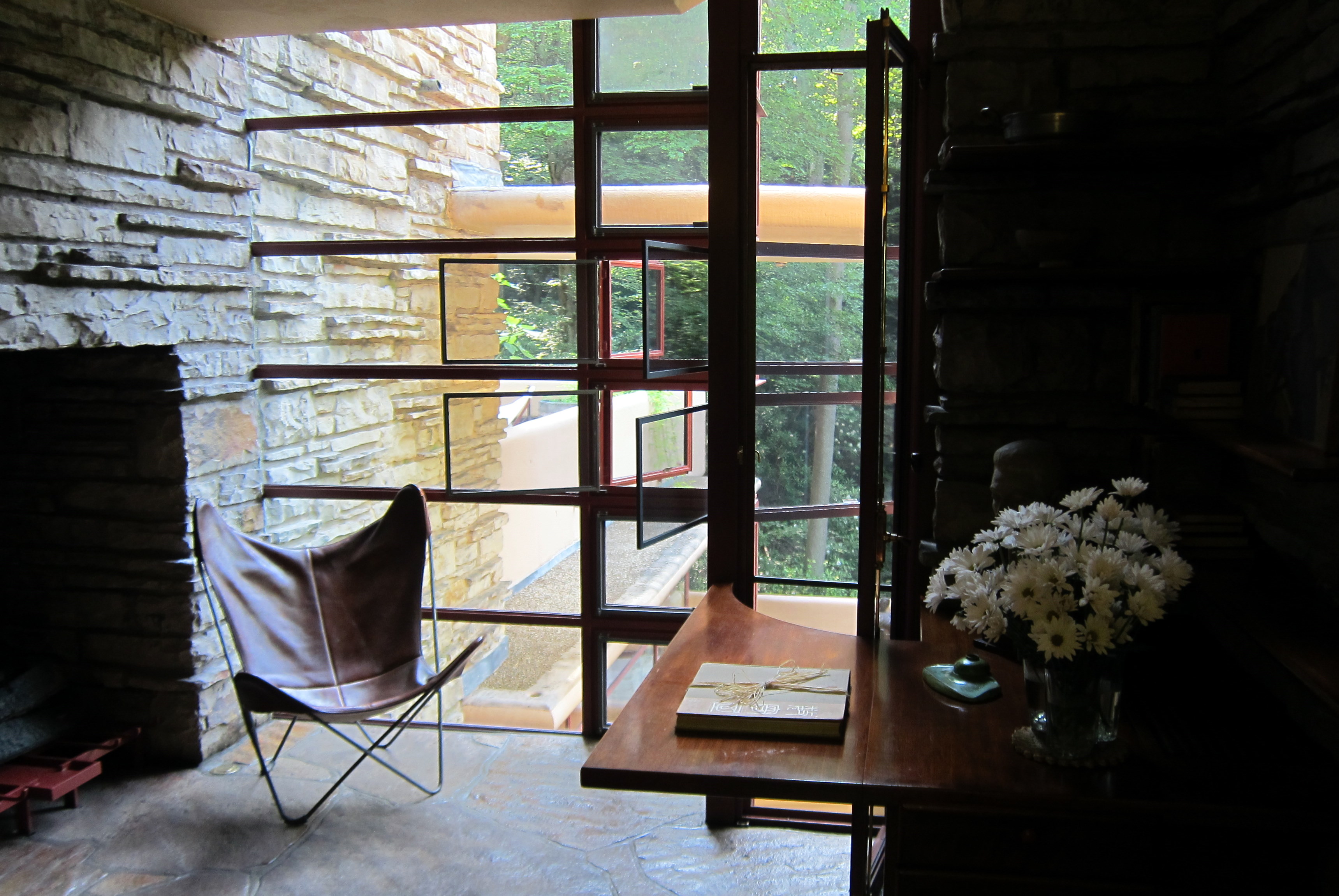 Fallingwater’s dressing room with built-in desk, corner window, and light shaft.