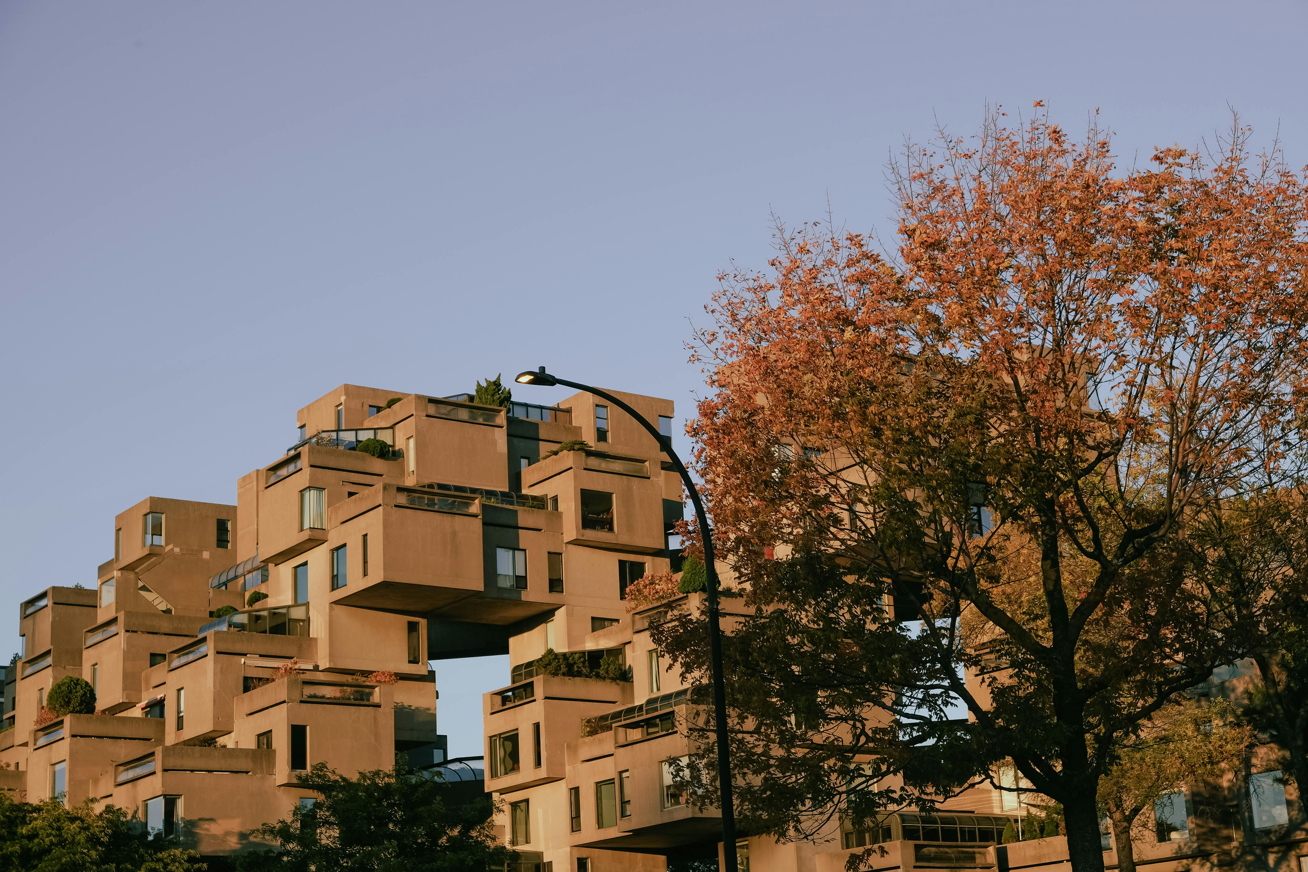 Brutalist housing complex Habitat 67 with stacked concrete modular units.
