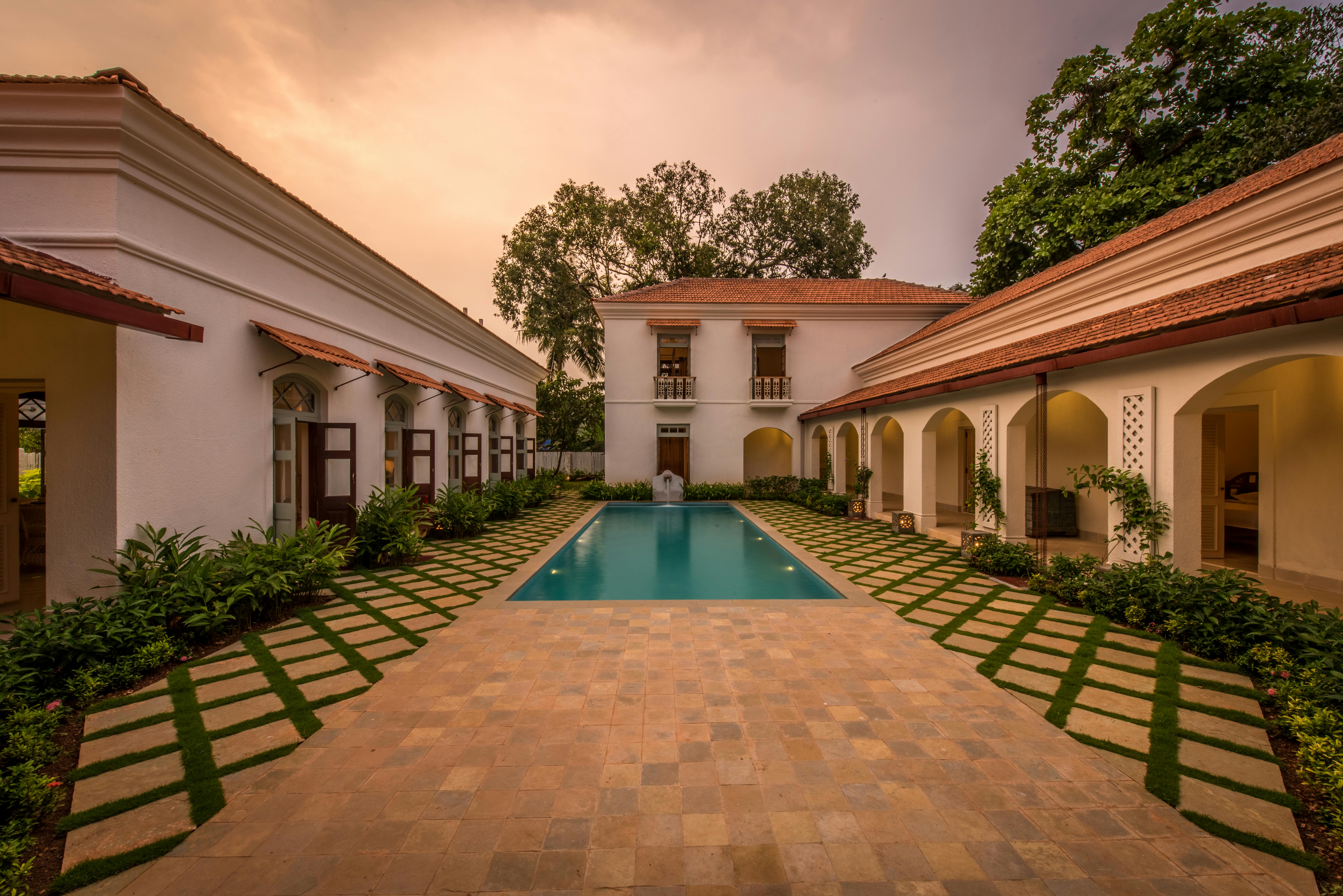  Central courtyard of a Mediterranean villa with plants and seating.