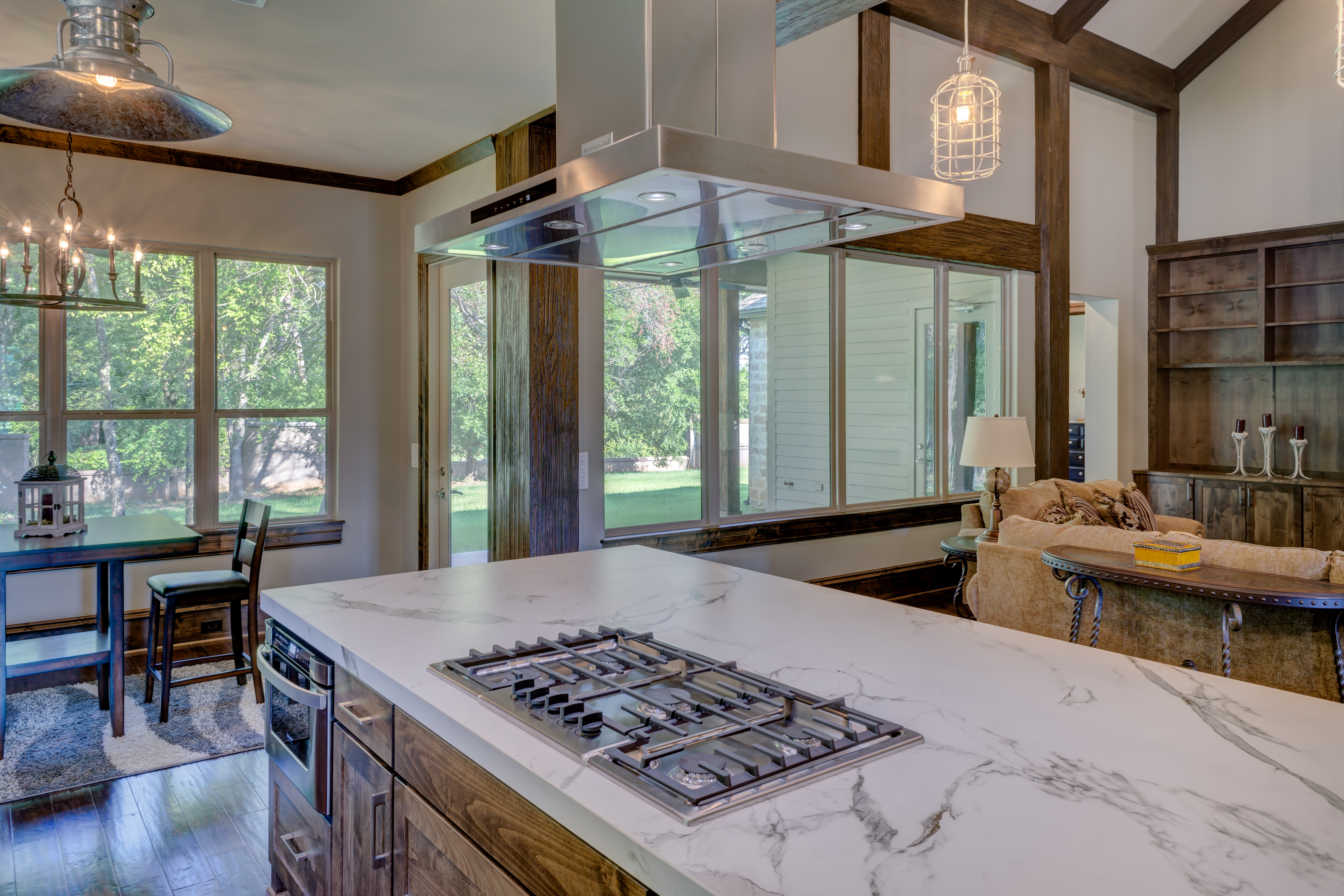 Mediterranean villa kitchen with wood cabinets and tile backsplash.