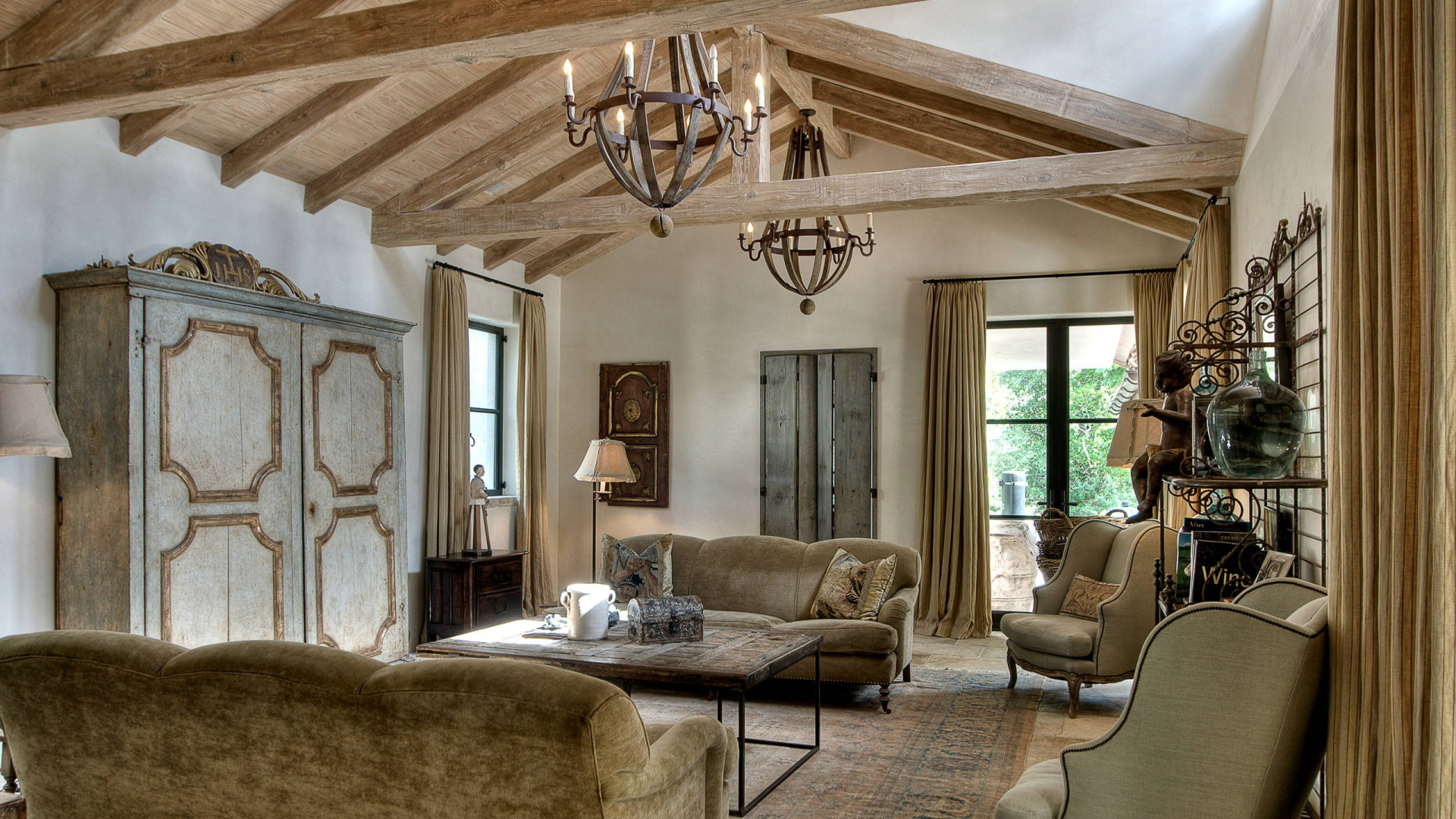 Beautiful Mediterranean living room with wooden beam ceilings and elegant decor.