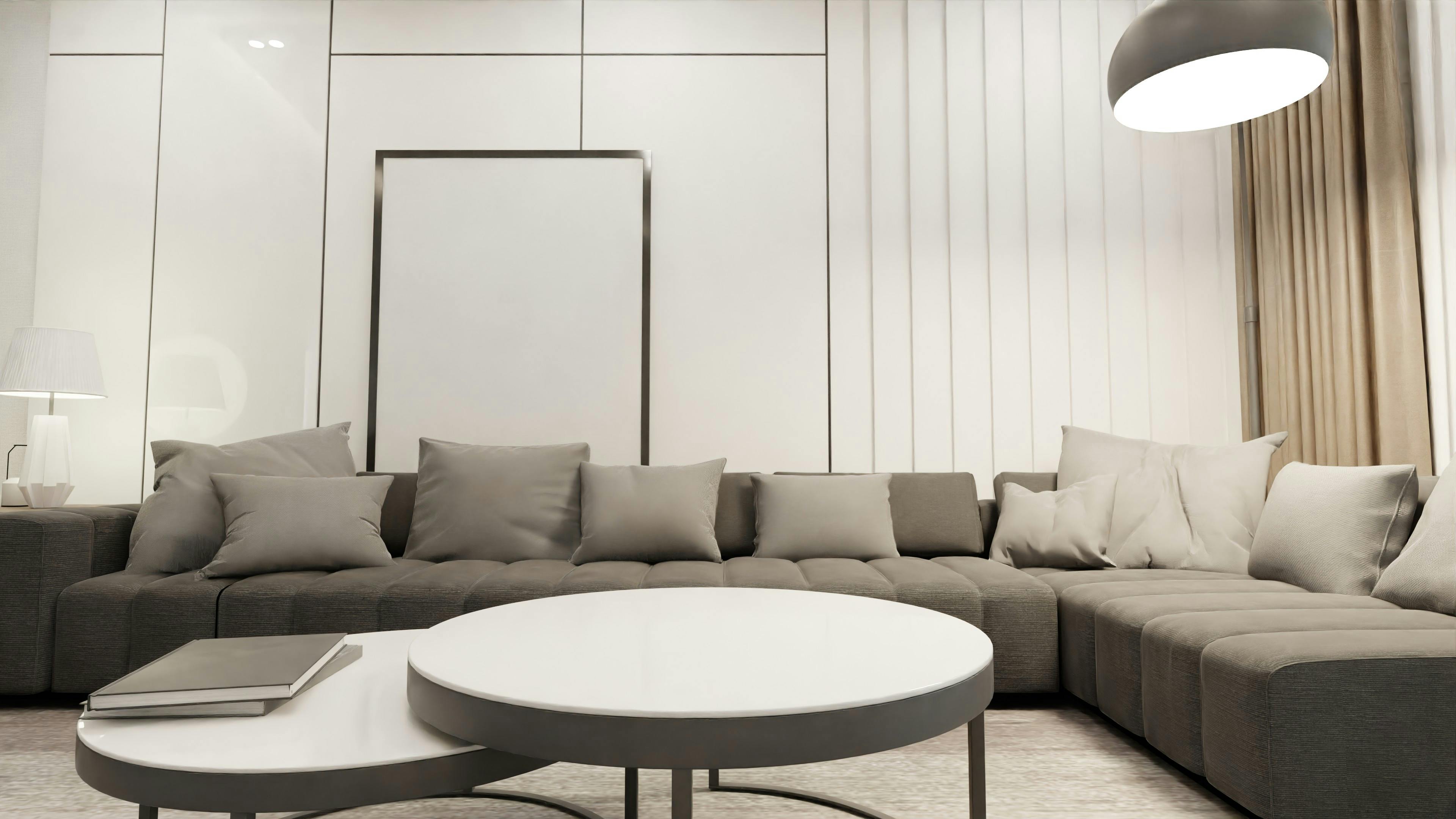 Minimal living room with central lighting and grey color palette.