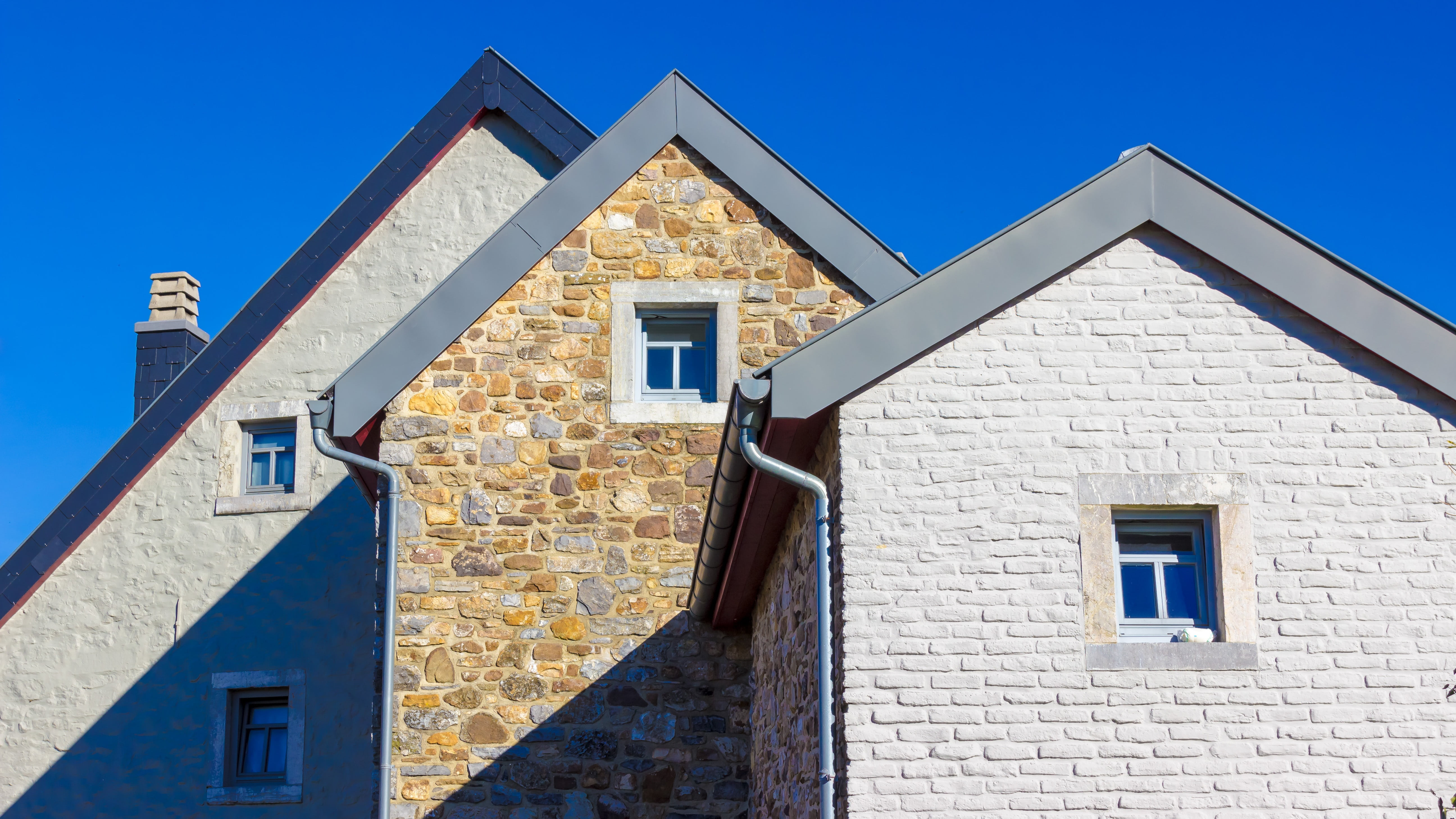 Facade of a modern house built with clean-lined stone design.