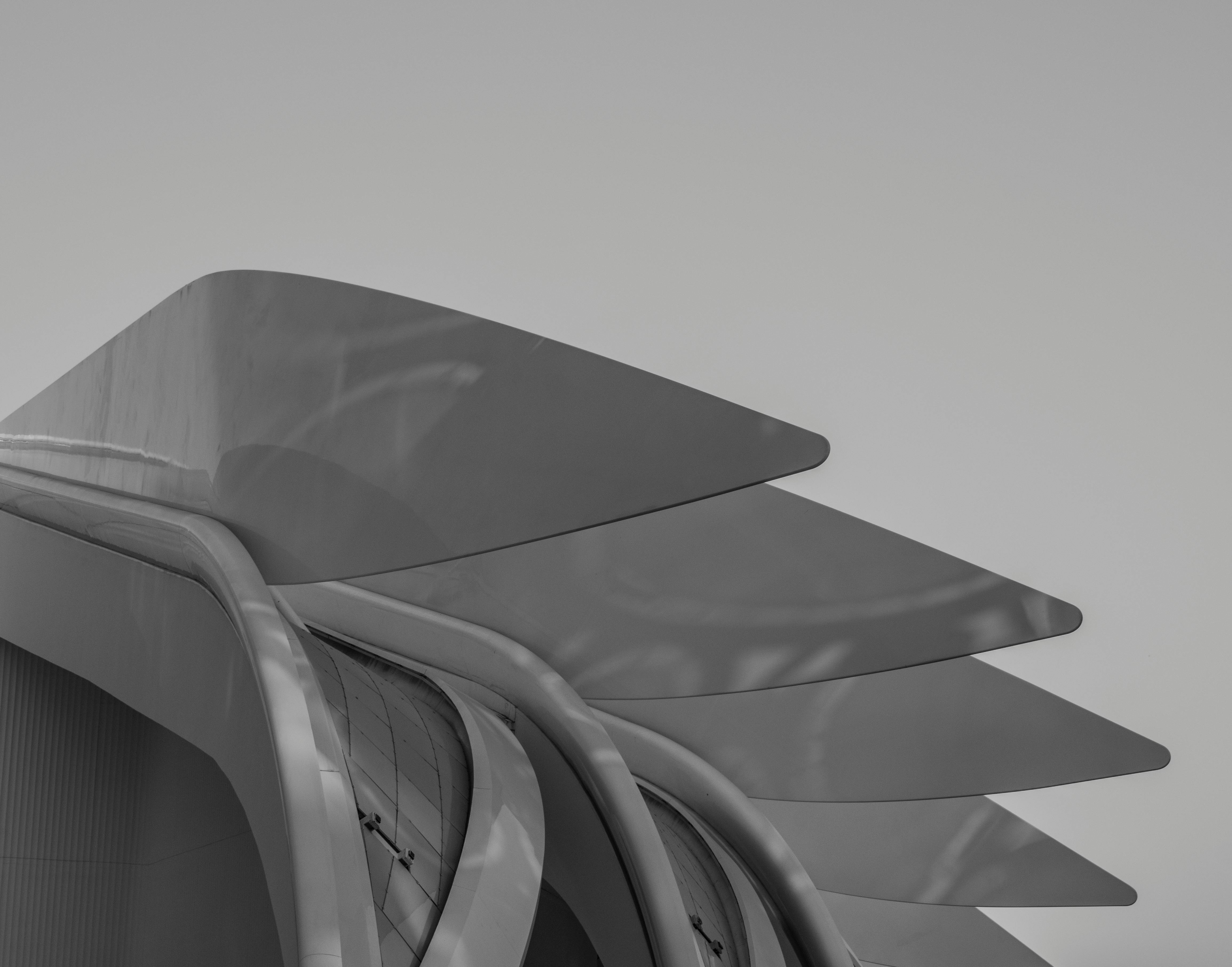 Parametric building with complex glass facade design.