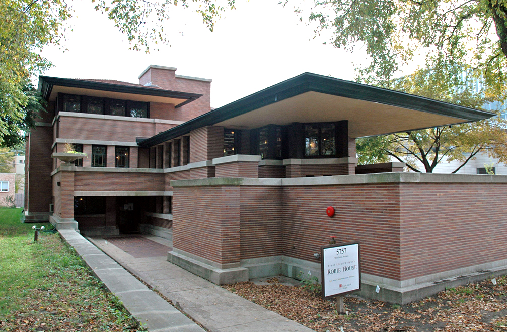 Robie House by Frank Lloyd Wright, a hallmark of Prairie School architecture featuring horizontal lines, overhanging eaves, and integration with the landscape.