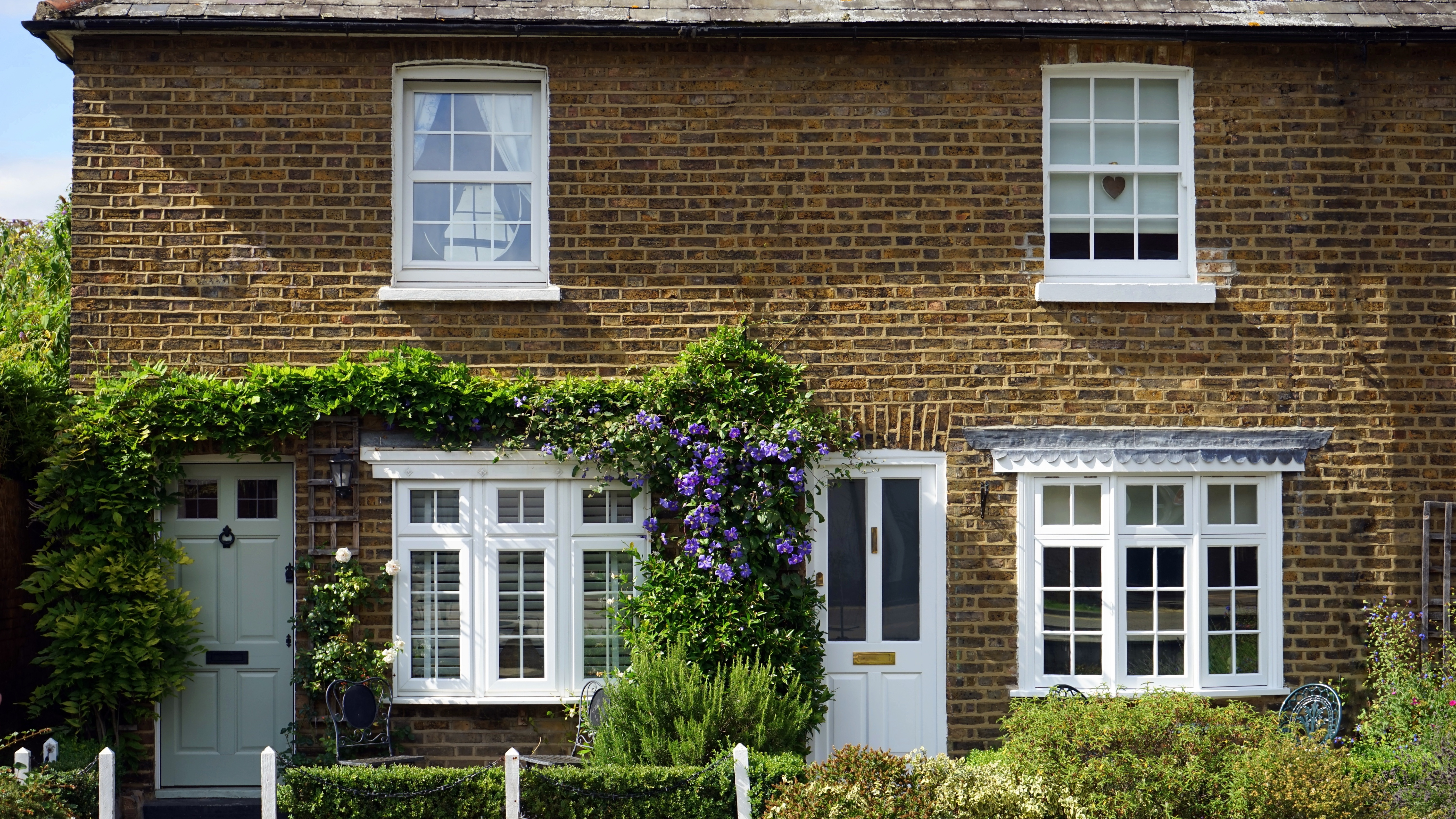 Rustic modern house facade with natural textures and simple wall design.