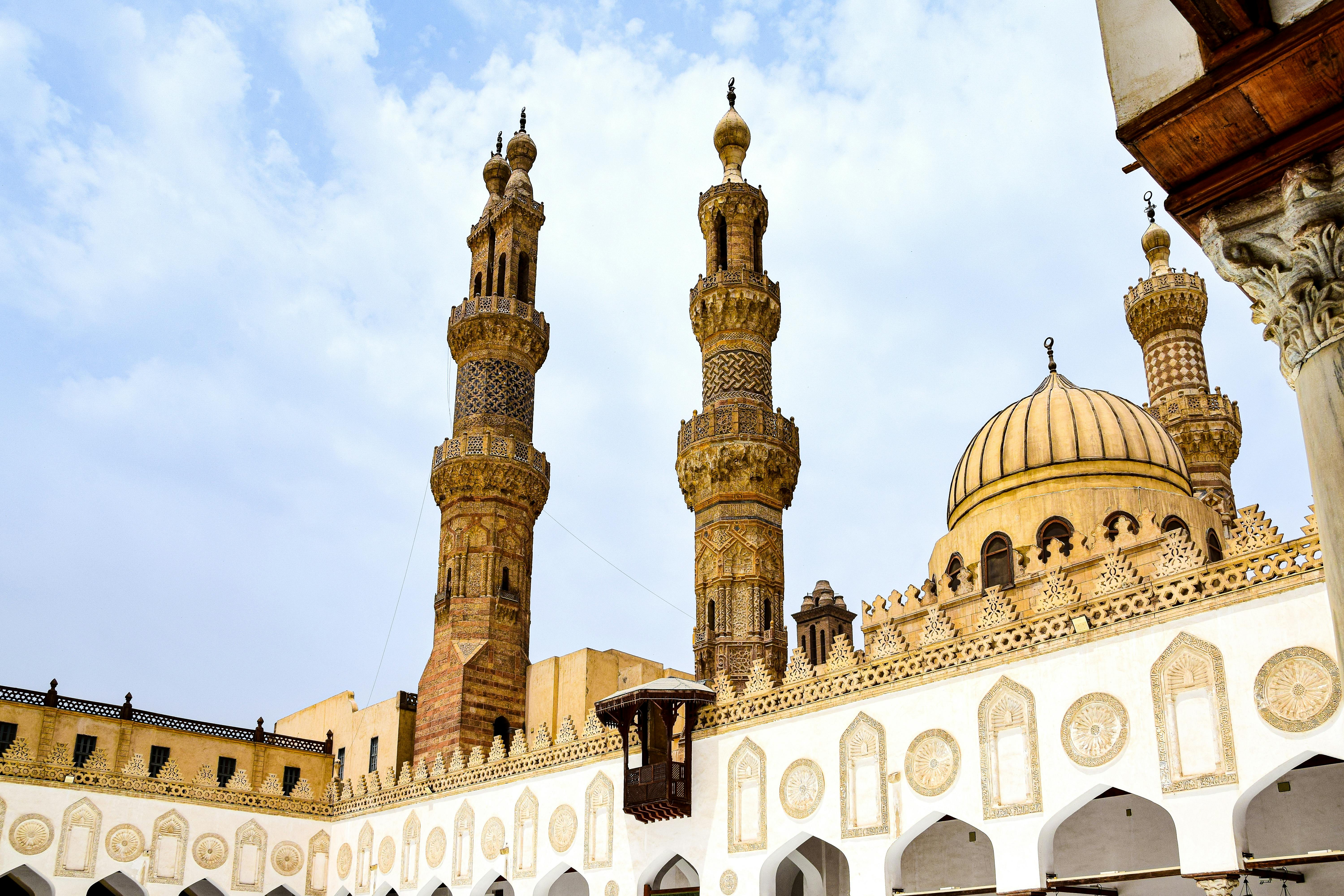 Al-Azhar Mosque exterior with minarets and historic facade.