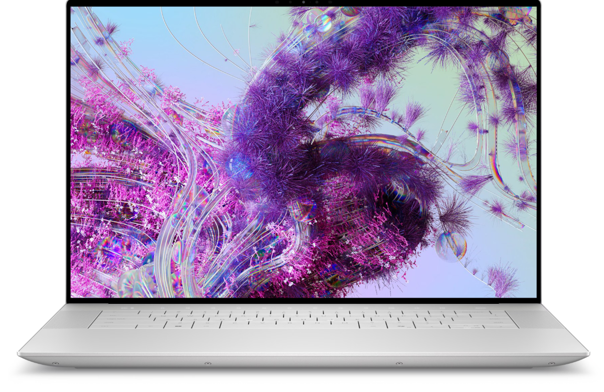 Dell XPS 16 laptop on desk with architectural sketches and digital tools.