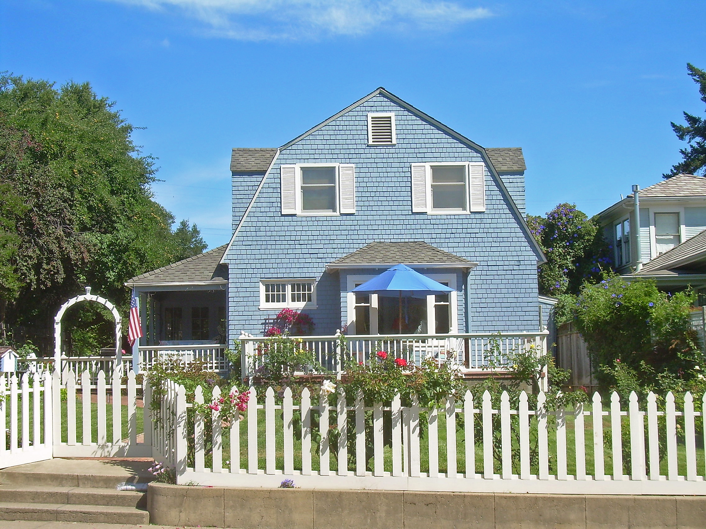 Dutch Colonial Revival home with classic features.