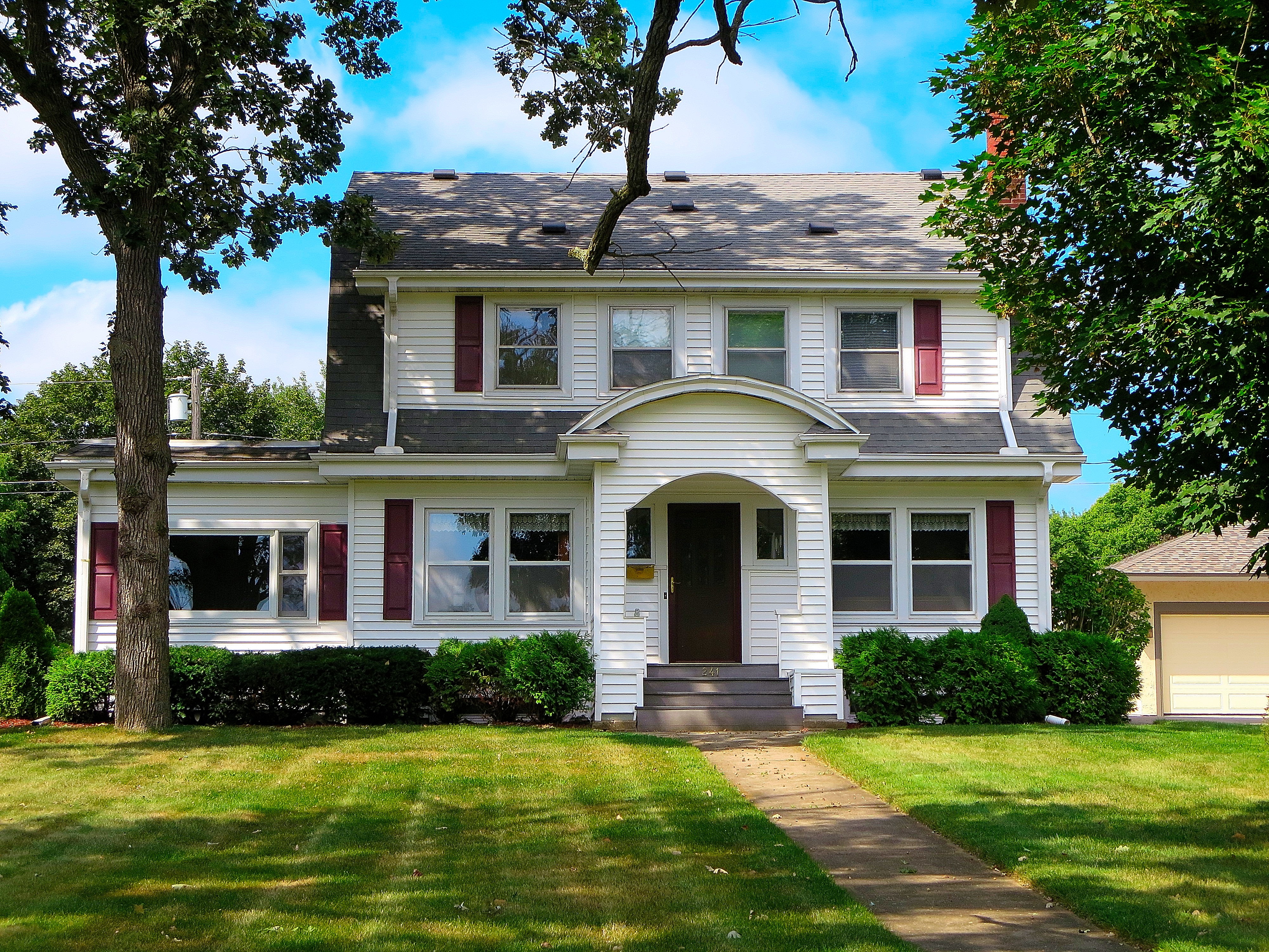 Dutch Colonial Revival style house exterior.