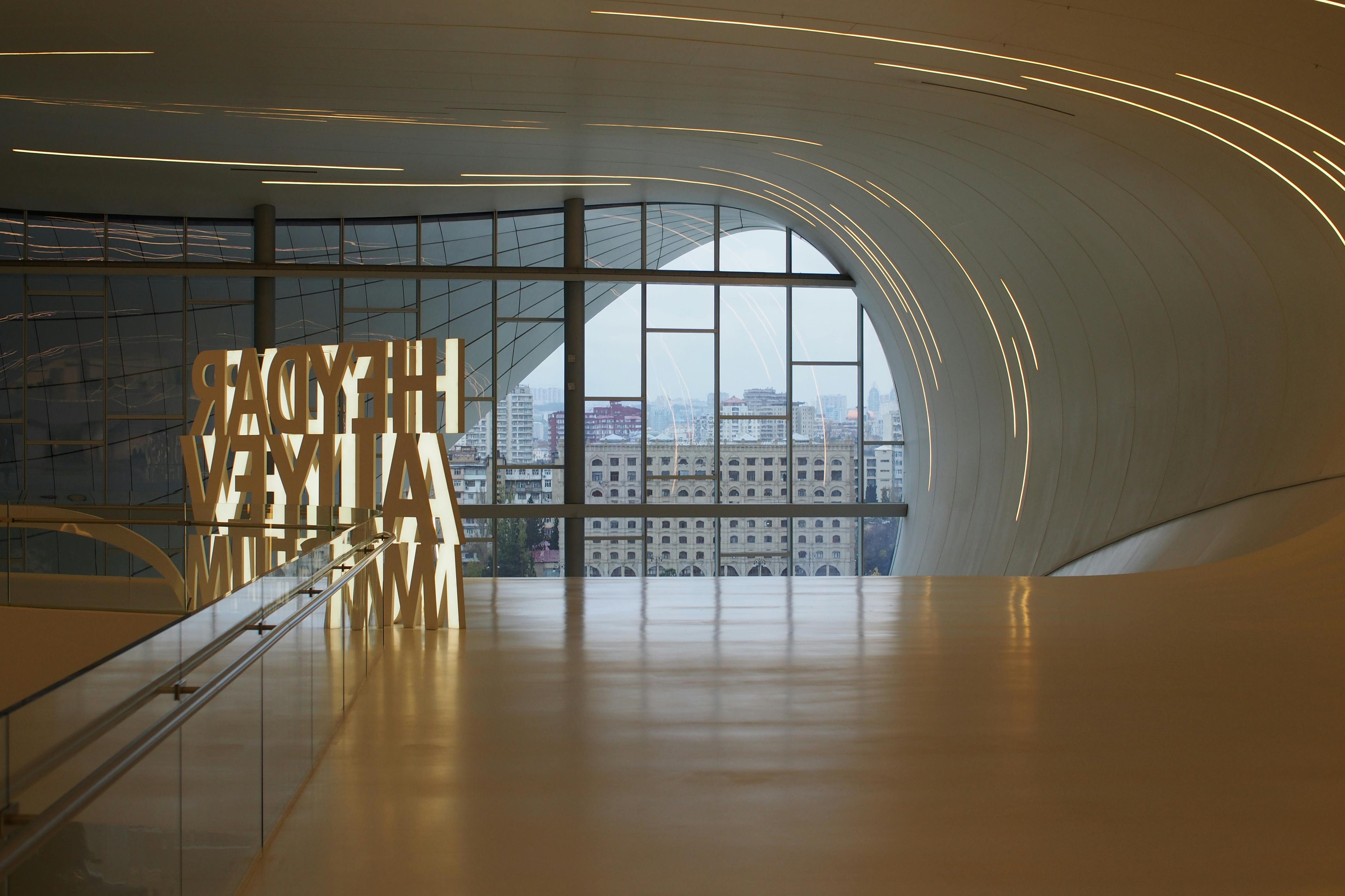 Interior of the Heydar Aliyev Centre in Baku with fluid architectural design.