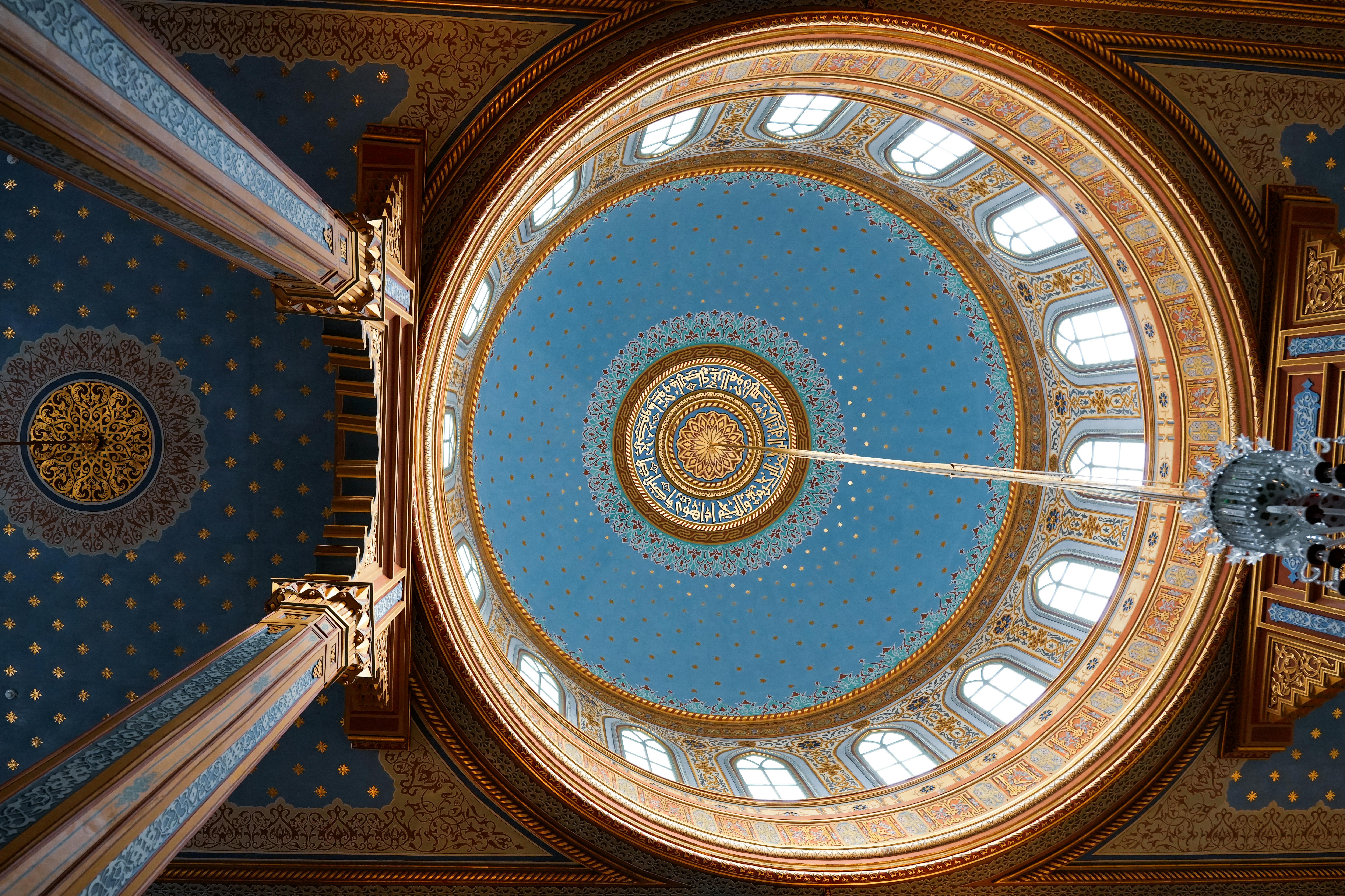 Intricate ceiling with Islamic patterns in Istanbul mosque.