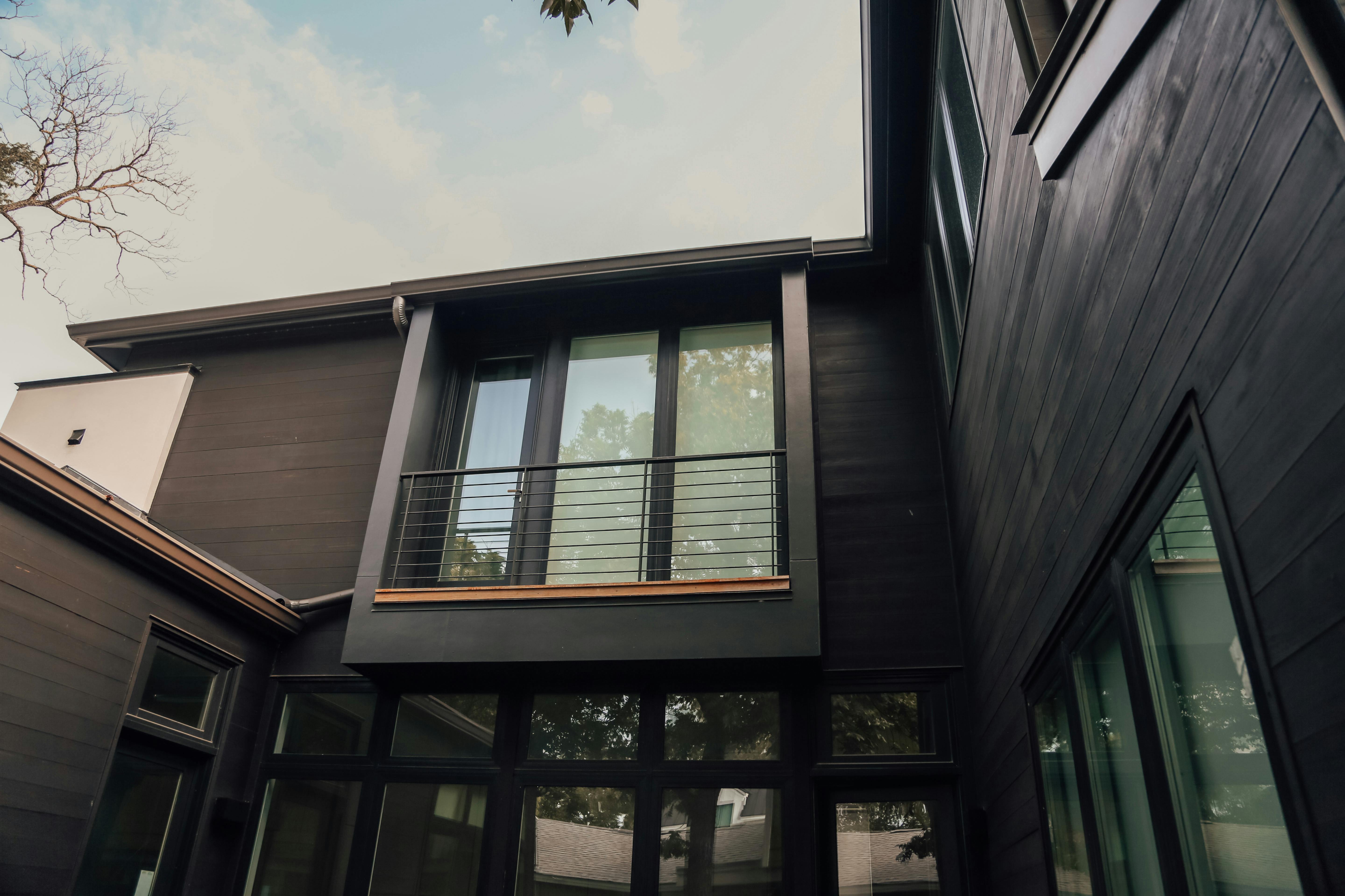 Exterior of a large, modern luxury house.