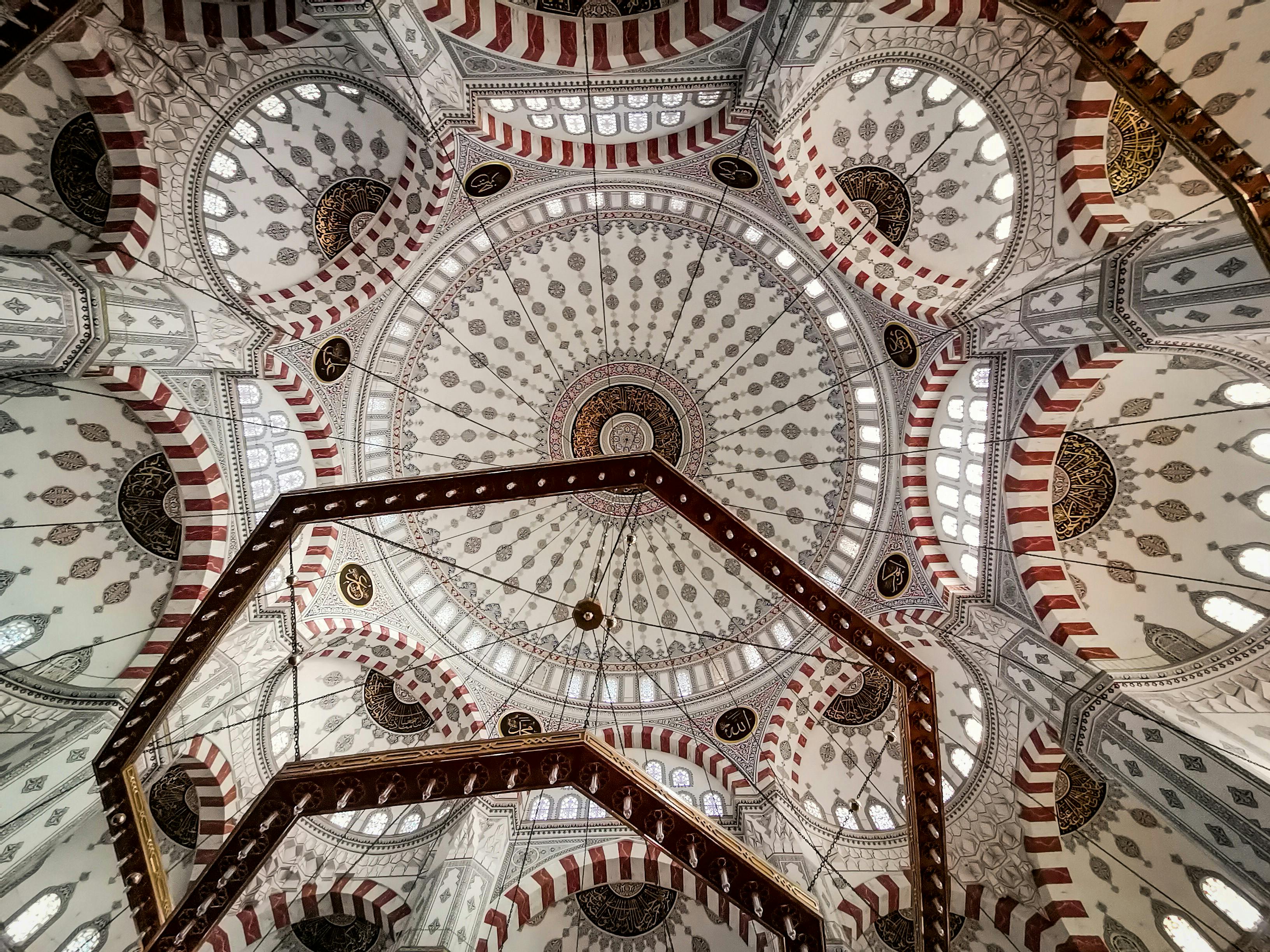 Ceiling of Süleymaniye Mosque with intricate Islamic geometric and calligraphic designs.