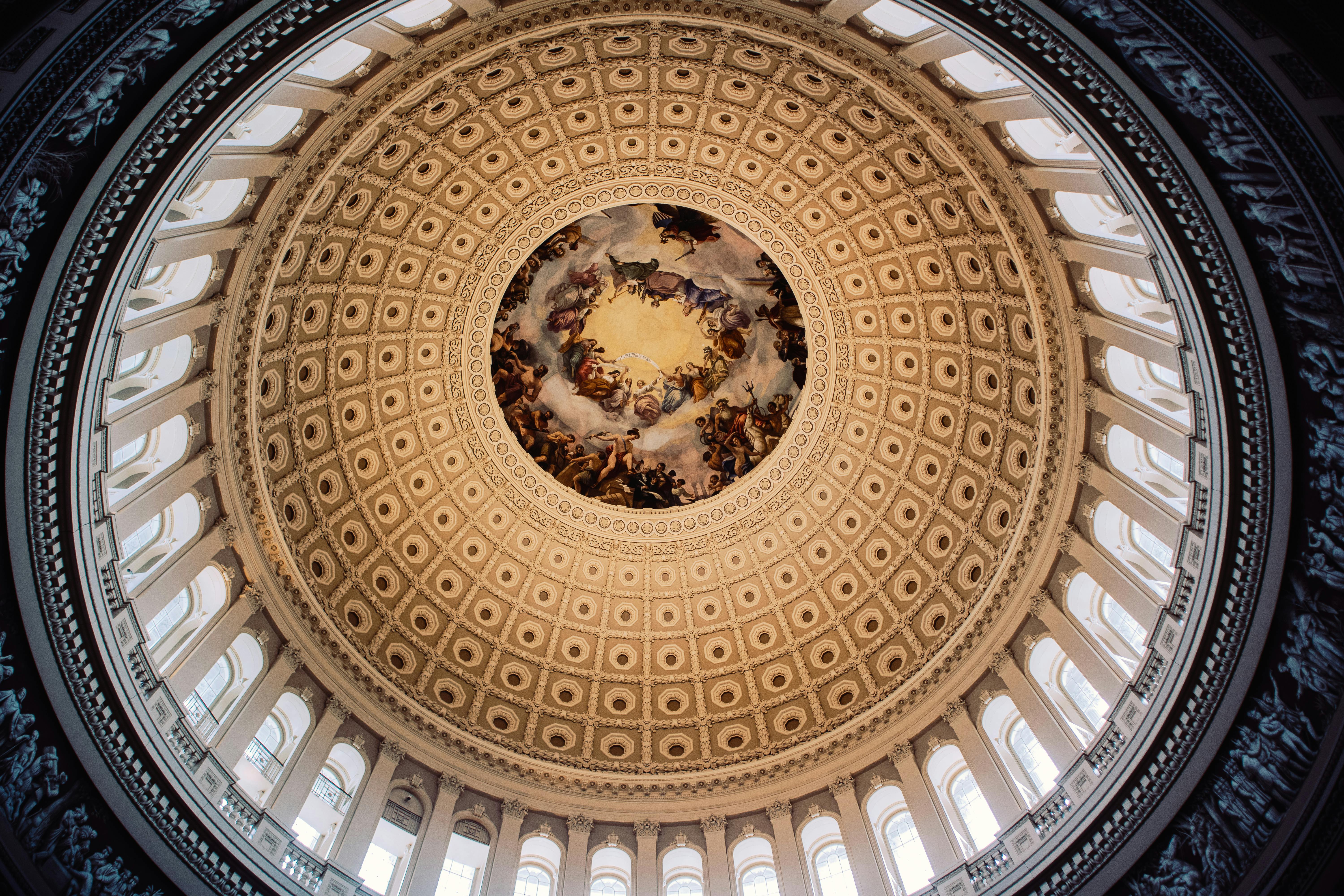 Rotunda of the U.S. Capitol in Washington, DC with Neoclassical architecture.