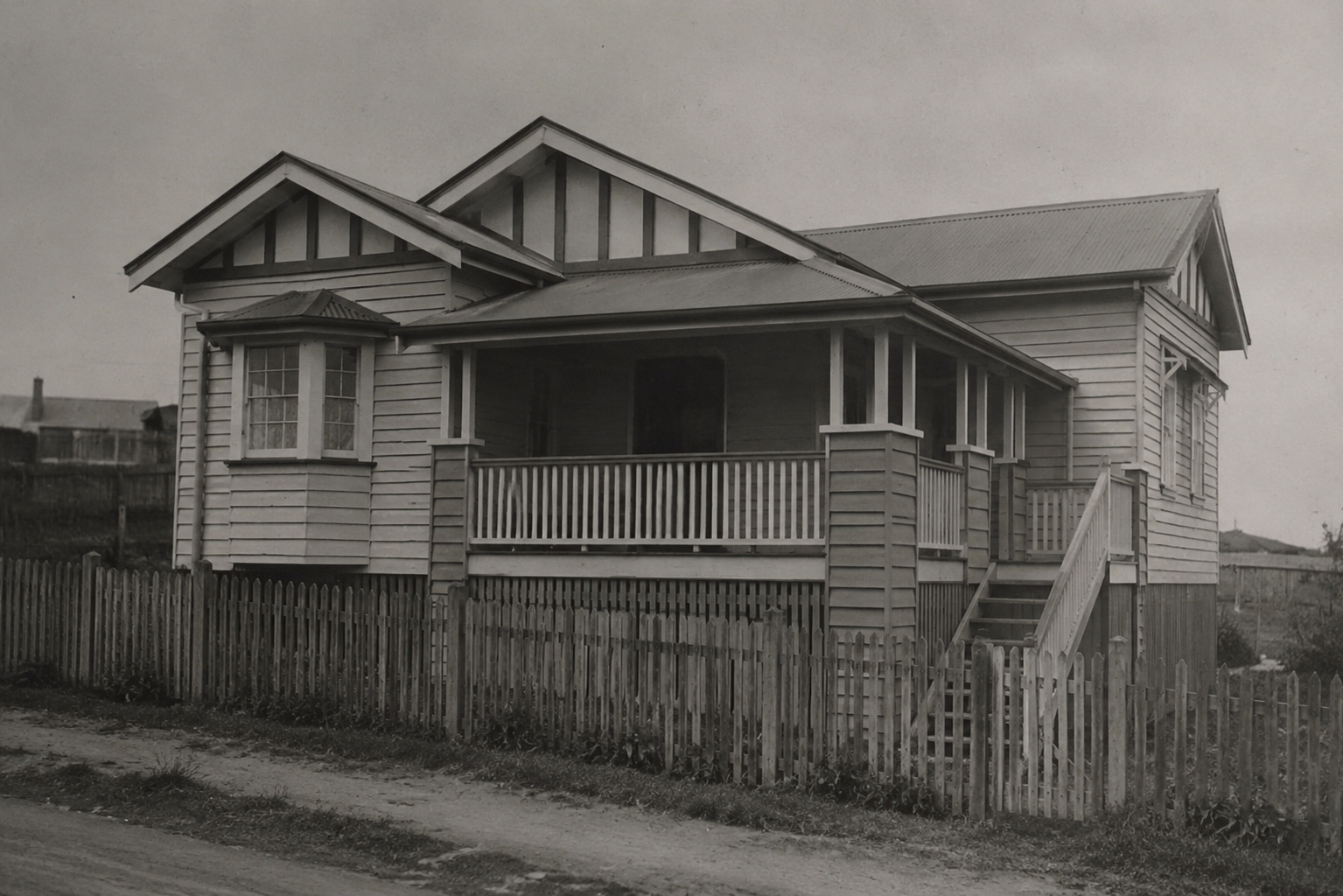 Enhanced 1930s Queenslander-style bungalow with white trim, colorized and cleaned for modern visual clarity