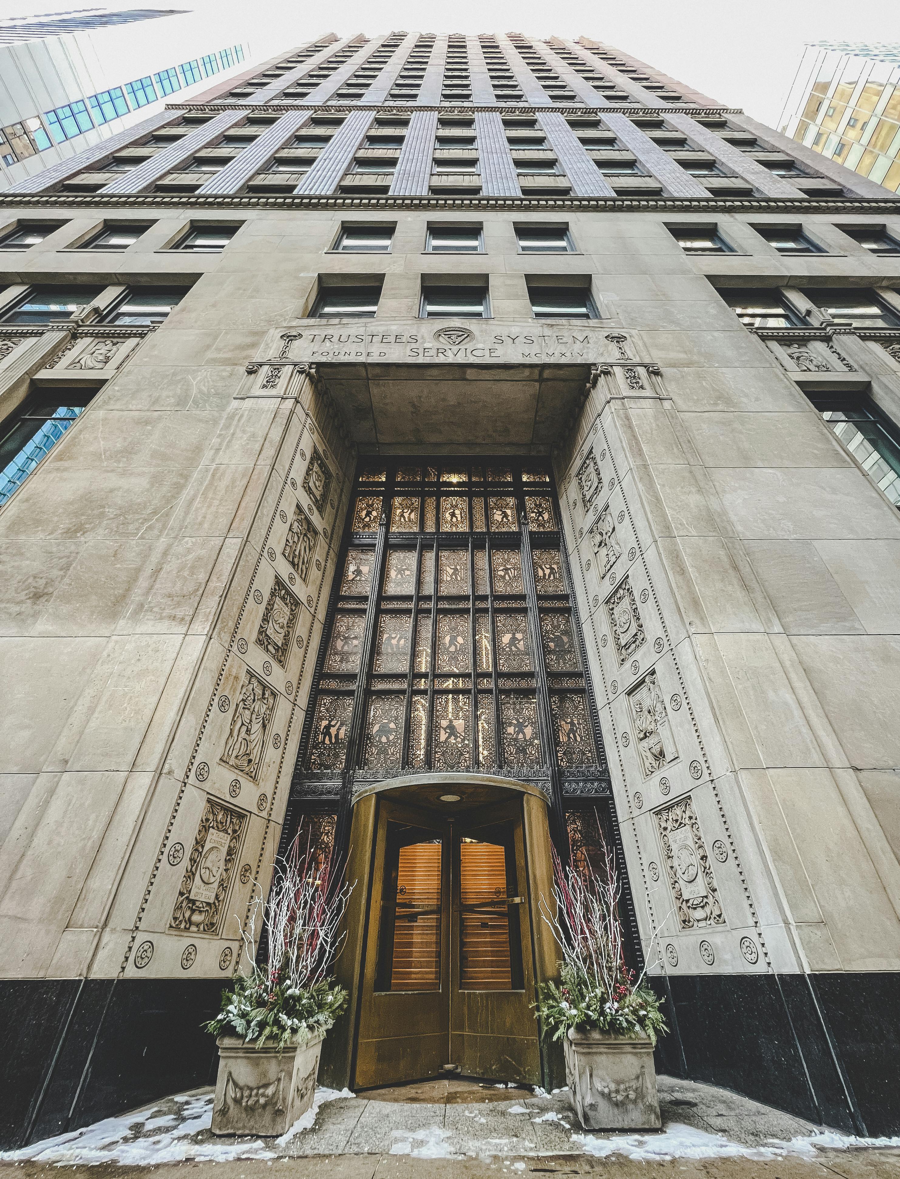 Art Deco skyscraper entrance of the Trustees System Service Building in Chicago.