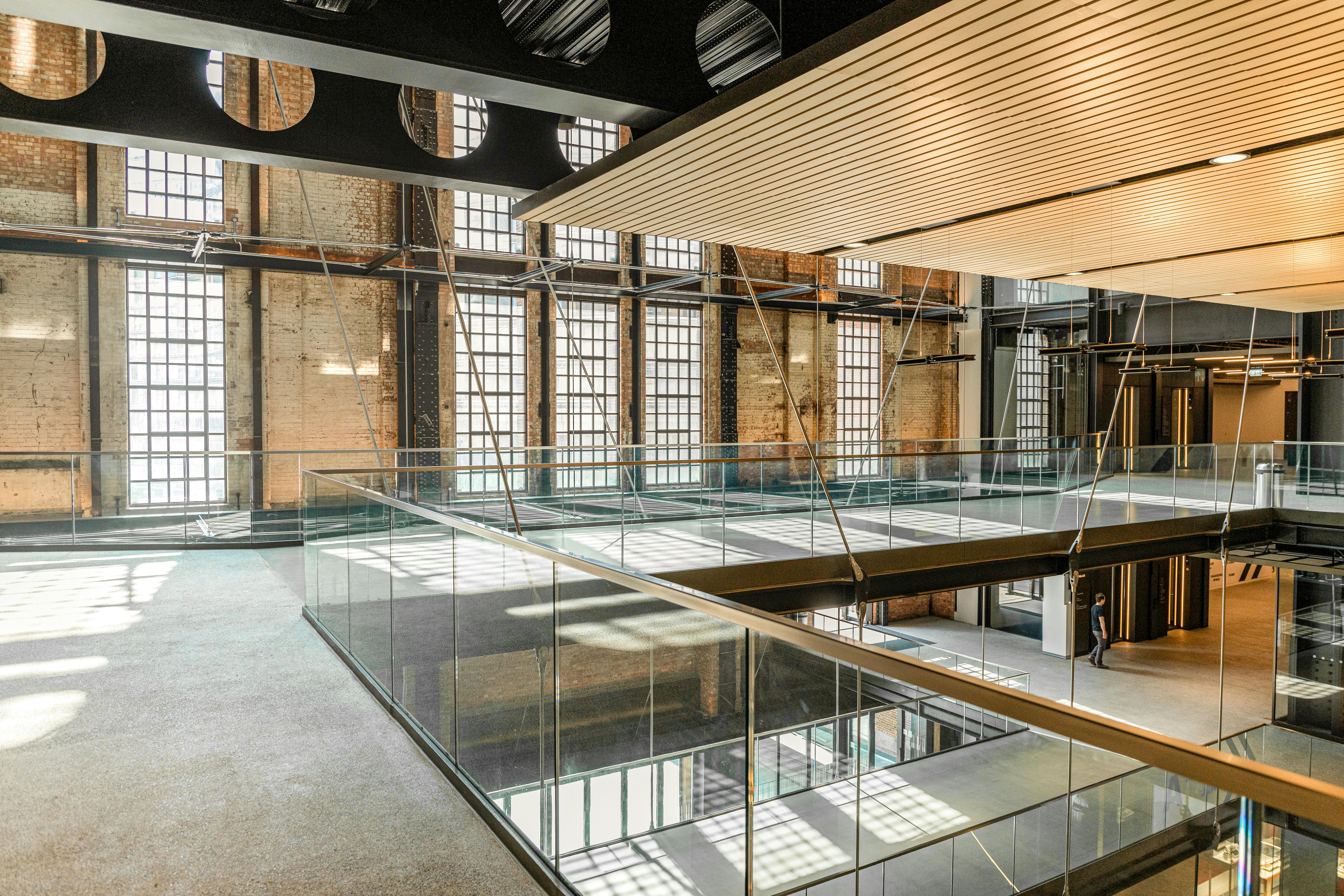 Interior of Battersea Power Station, London. A clean blend of raw steel and warm wood. Modern. Industrial. Human.
