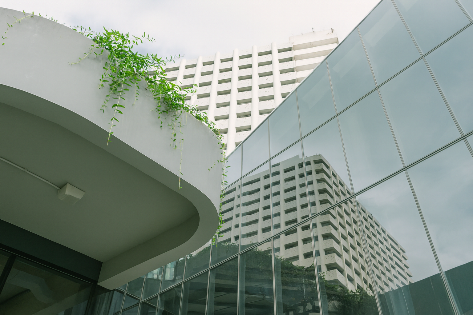 Concrete office building with greenery on every level.