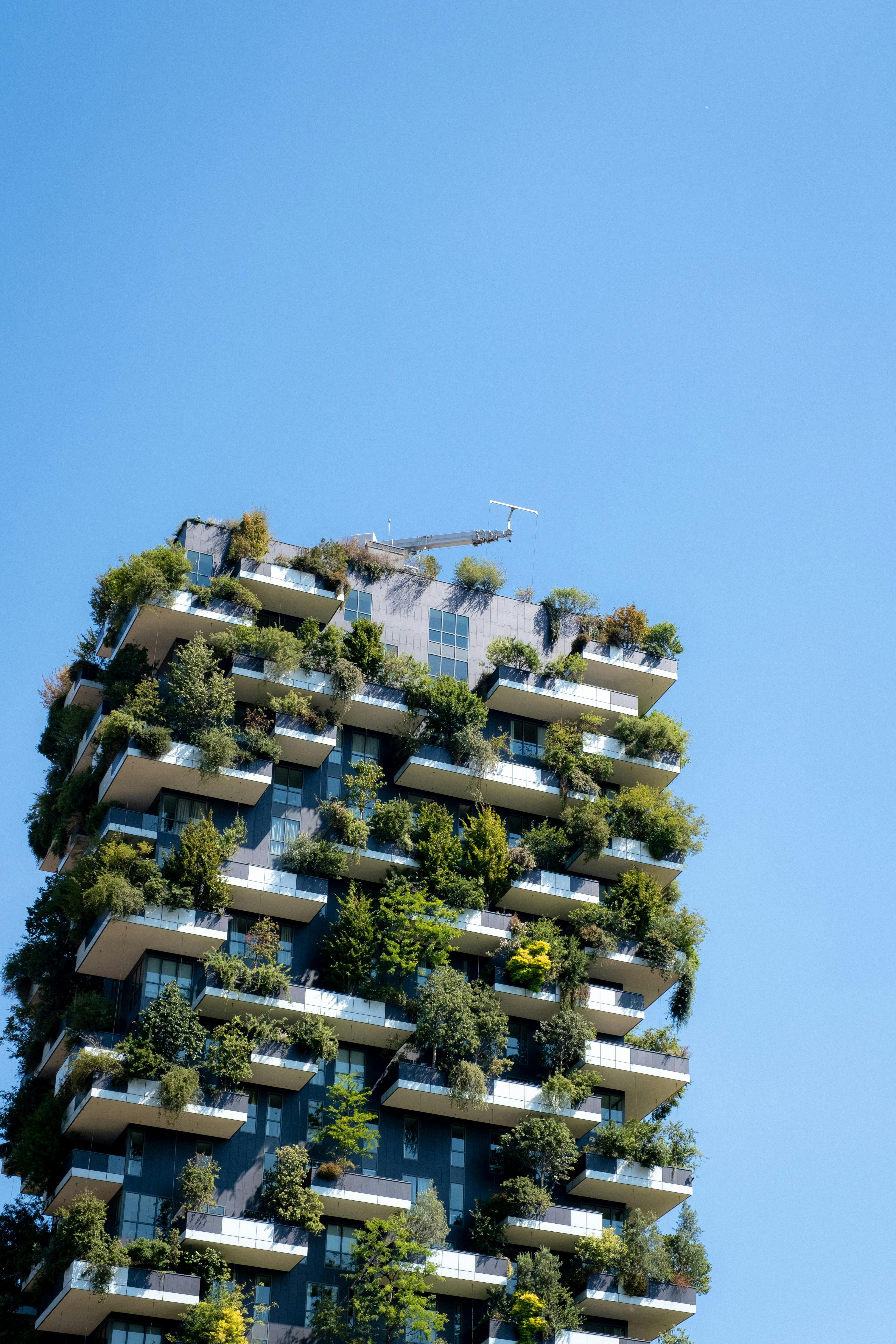 Low-angle view of the Bosco Verticale residential towers in Milan, Italy.