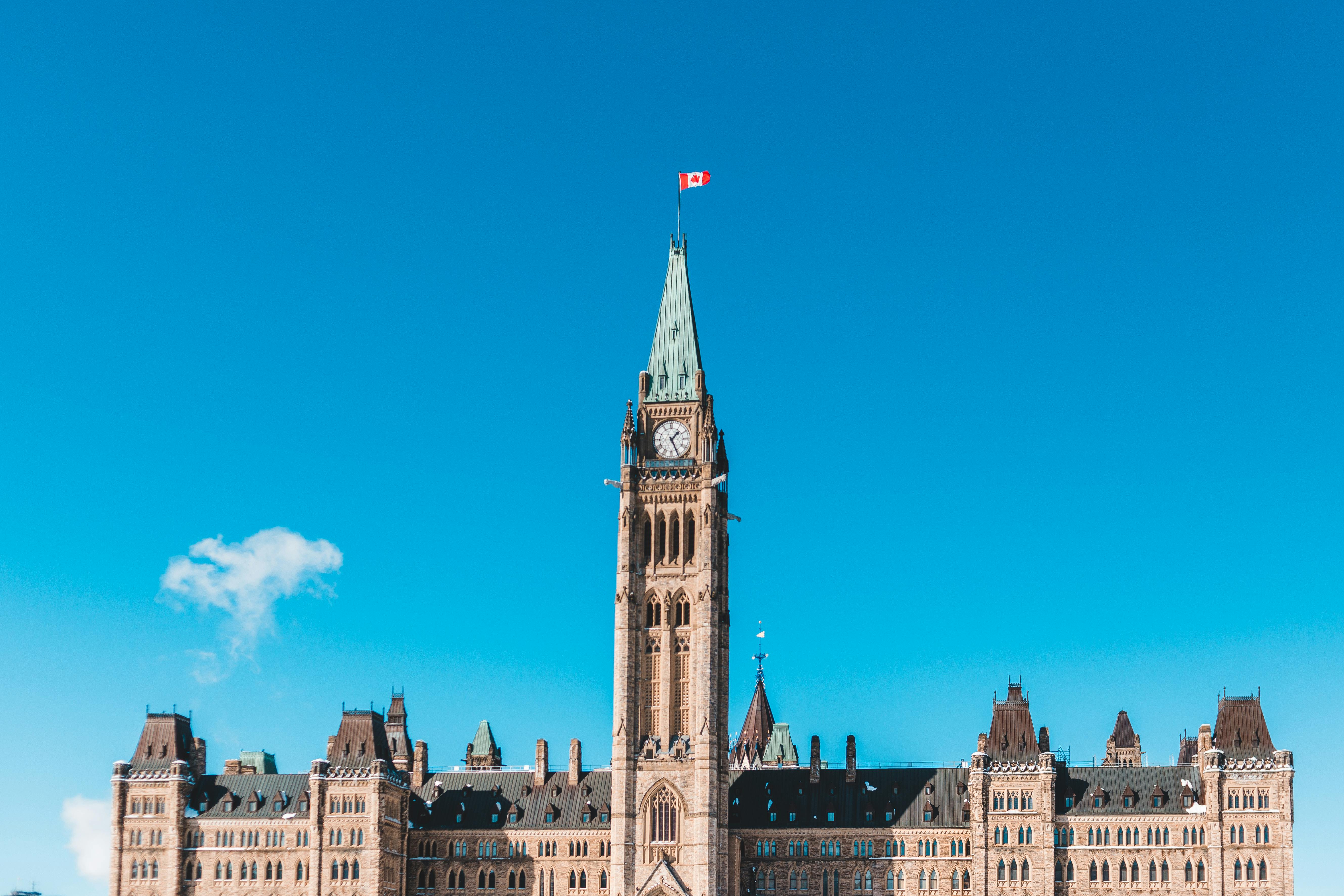 Canadian Parliament building front with Gothic Revival detailing.