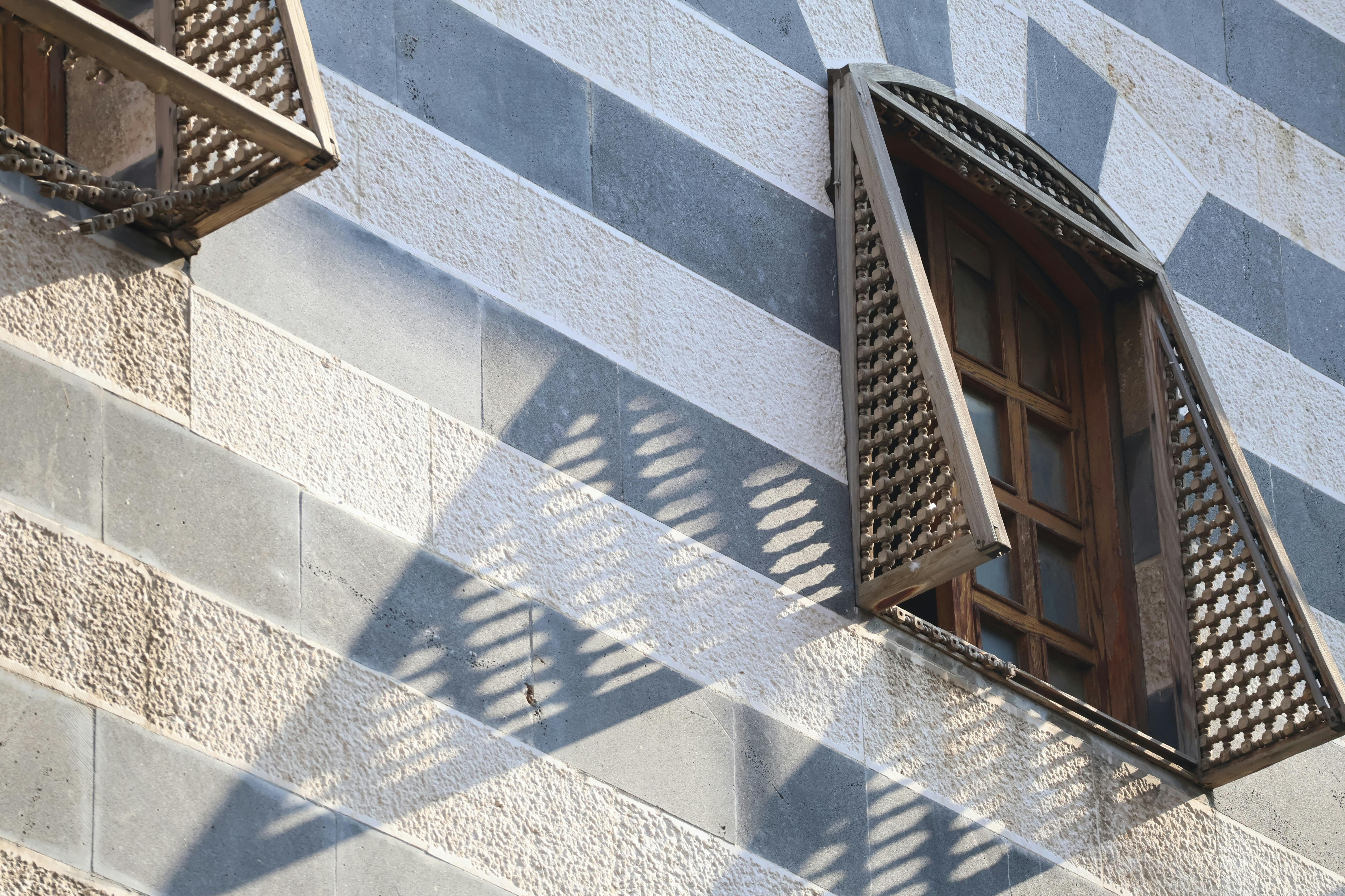 Traditional Mashrabiya window with wooden lattice in Damascus.