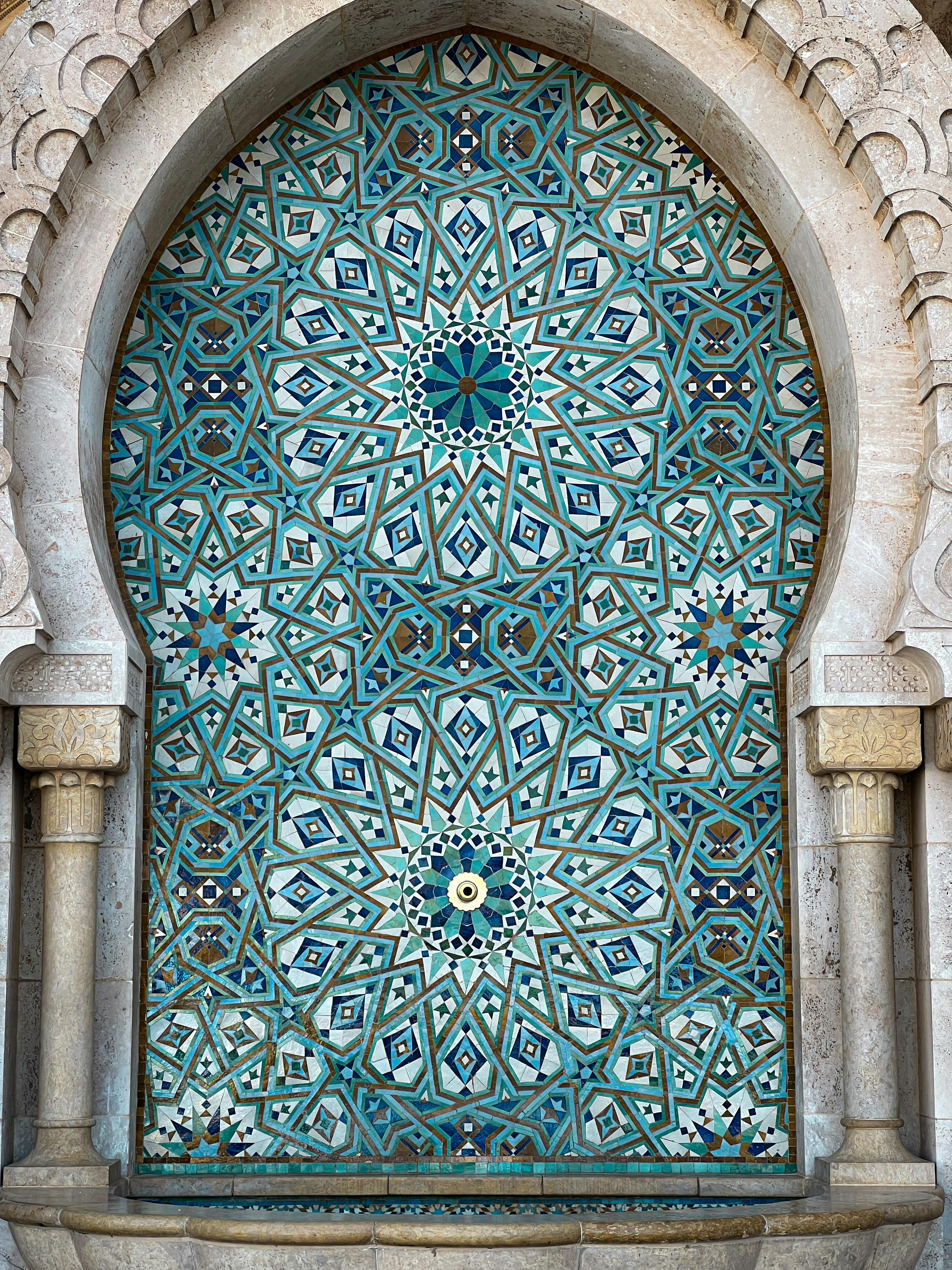 Traditional Moroccan archway with Islamic tile mosaic.