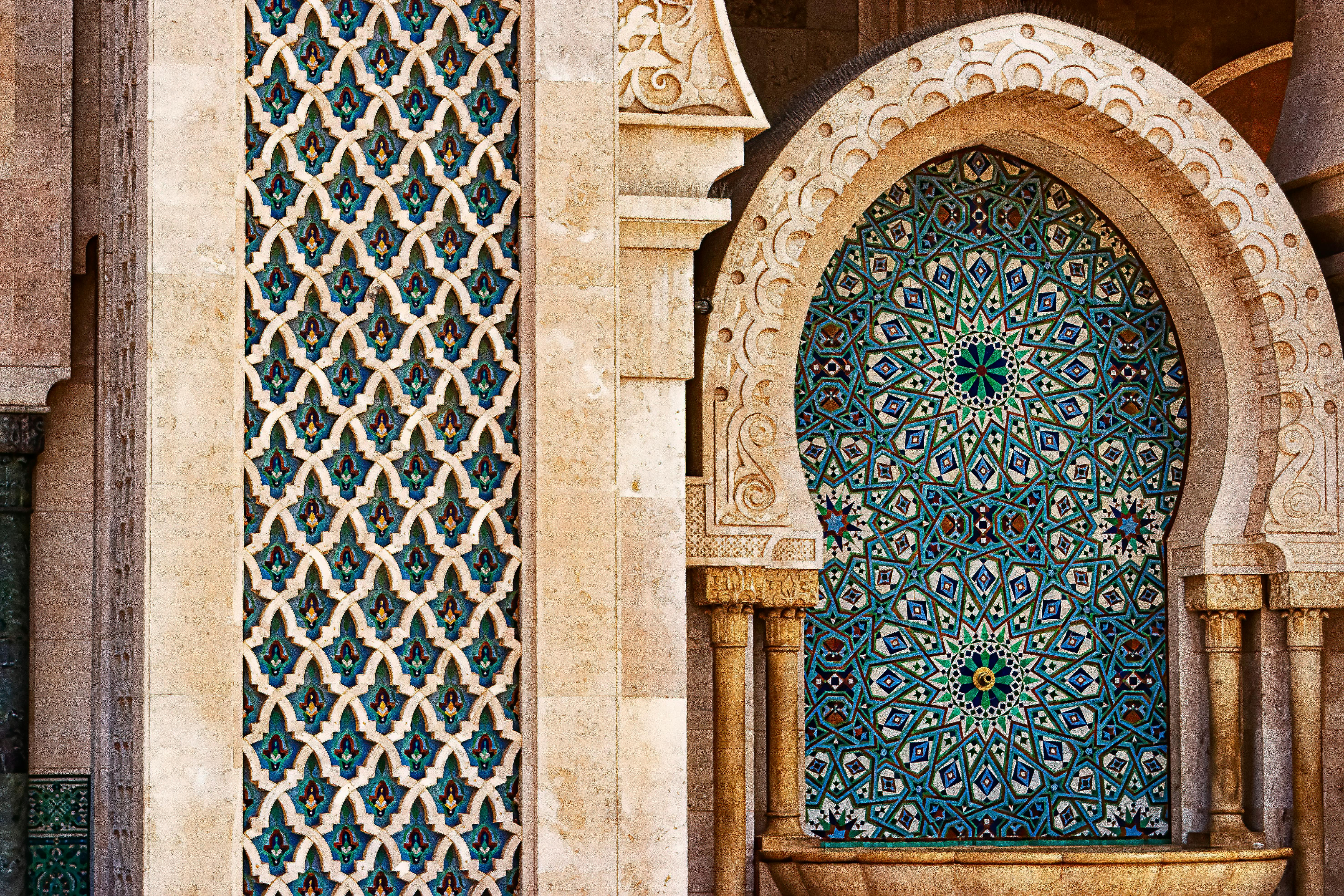 Moroccan Islamic tile fountain with horseshoe arches.