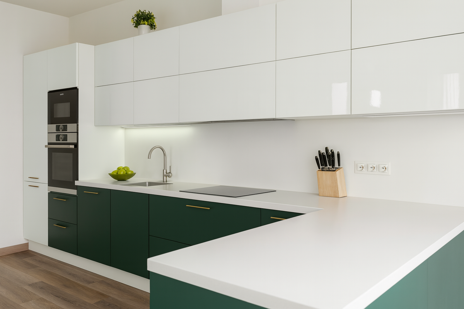 Modern kitchen with white upper cabinets, green lower cabinets, brass handles, and dark countertops.