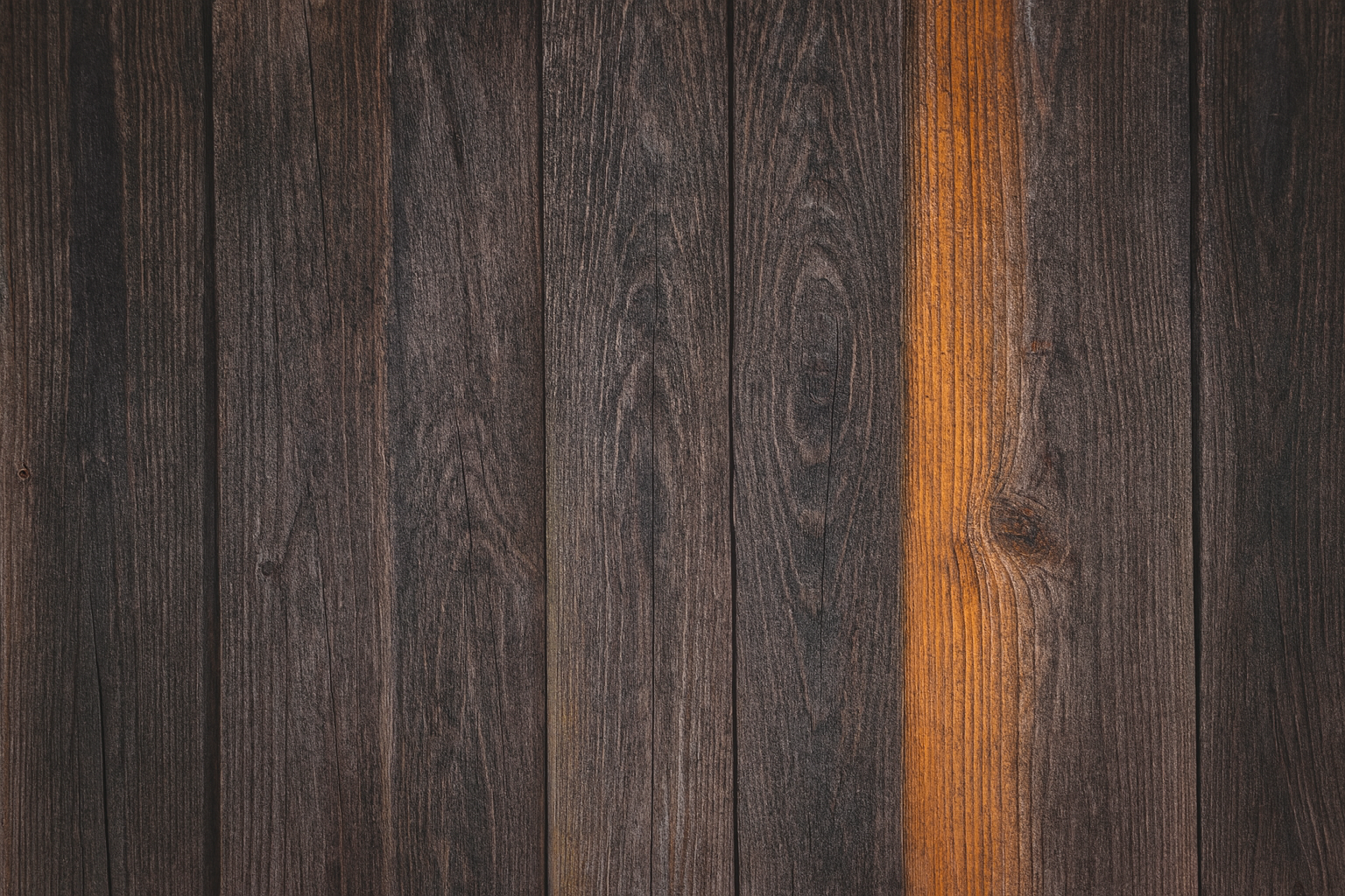Weathered wooden planks with dark grains and a mustard-yellow accent strip.