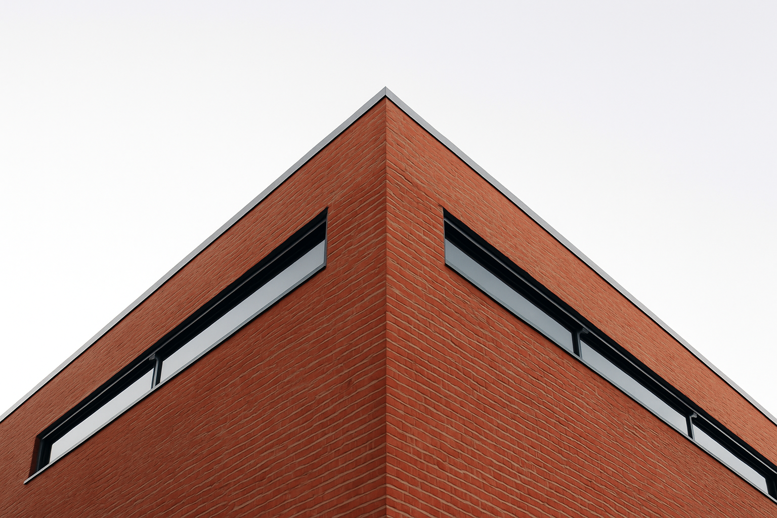 Contemporary brick building with horztntal windows.