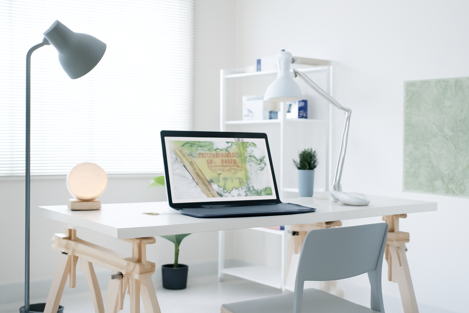 An architect's workspace with a laptop displaying a detailed site analysis diagram.
