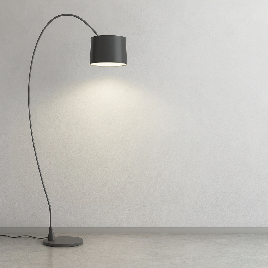 Contemporary curved floor lamp casting soft ambient light on a textured gray wall.