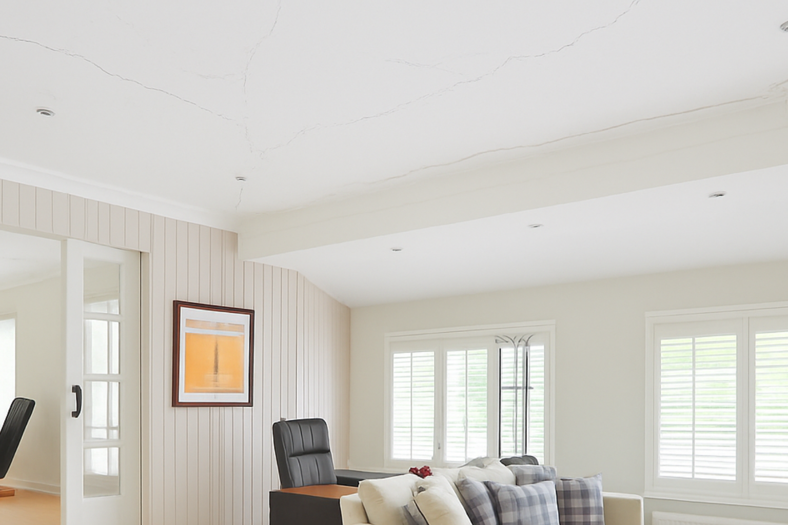 Visible cracks on walls in a newly built modern house.